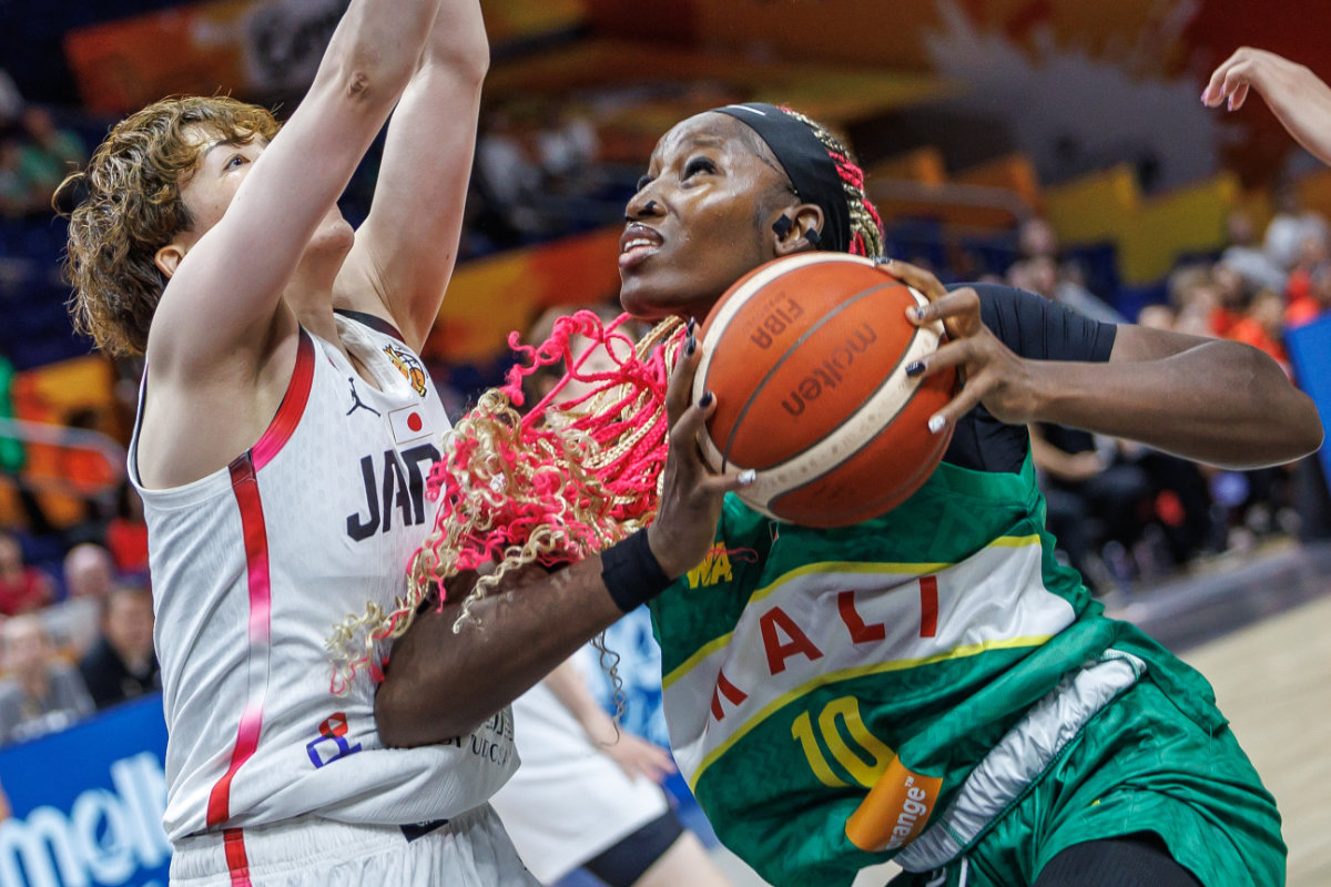 Mali's Maimouna Haidara, right, and Japan's Saki Hayashi during the women's World Cup basketball match between Mali and Japan, in Berlin on Sept. 4, 2026. (dpa via AP)
