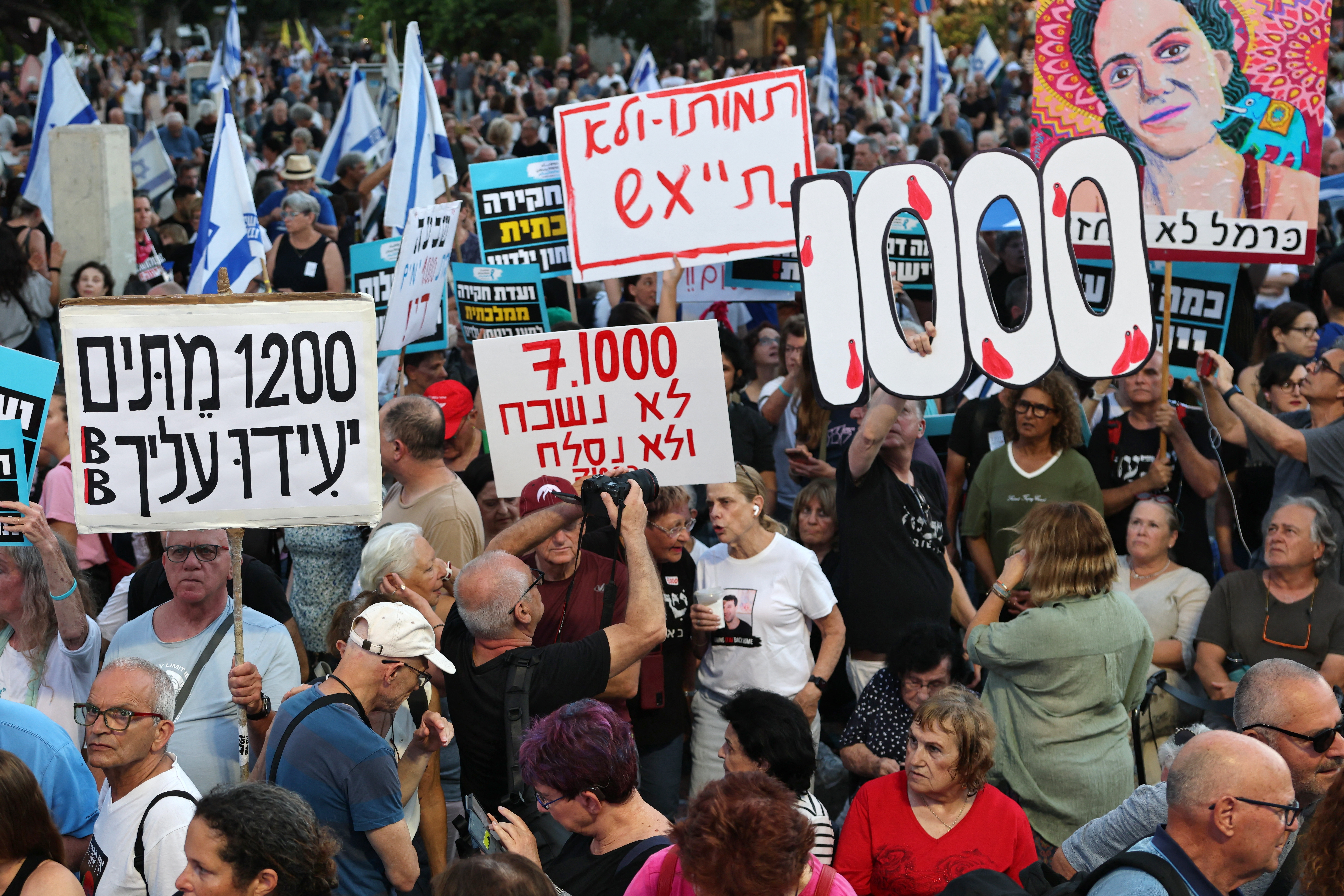 Israeli protesters hold placards during a rally against the government and the war in Gaza, at Hostage Square in Tel Aviv, on July 2, 2026. (AFP file)