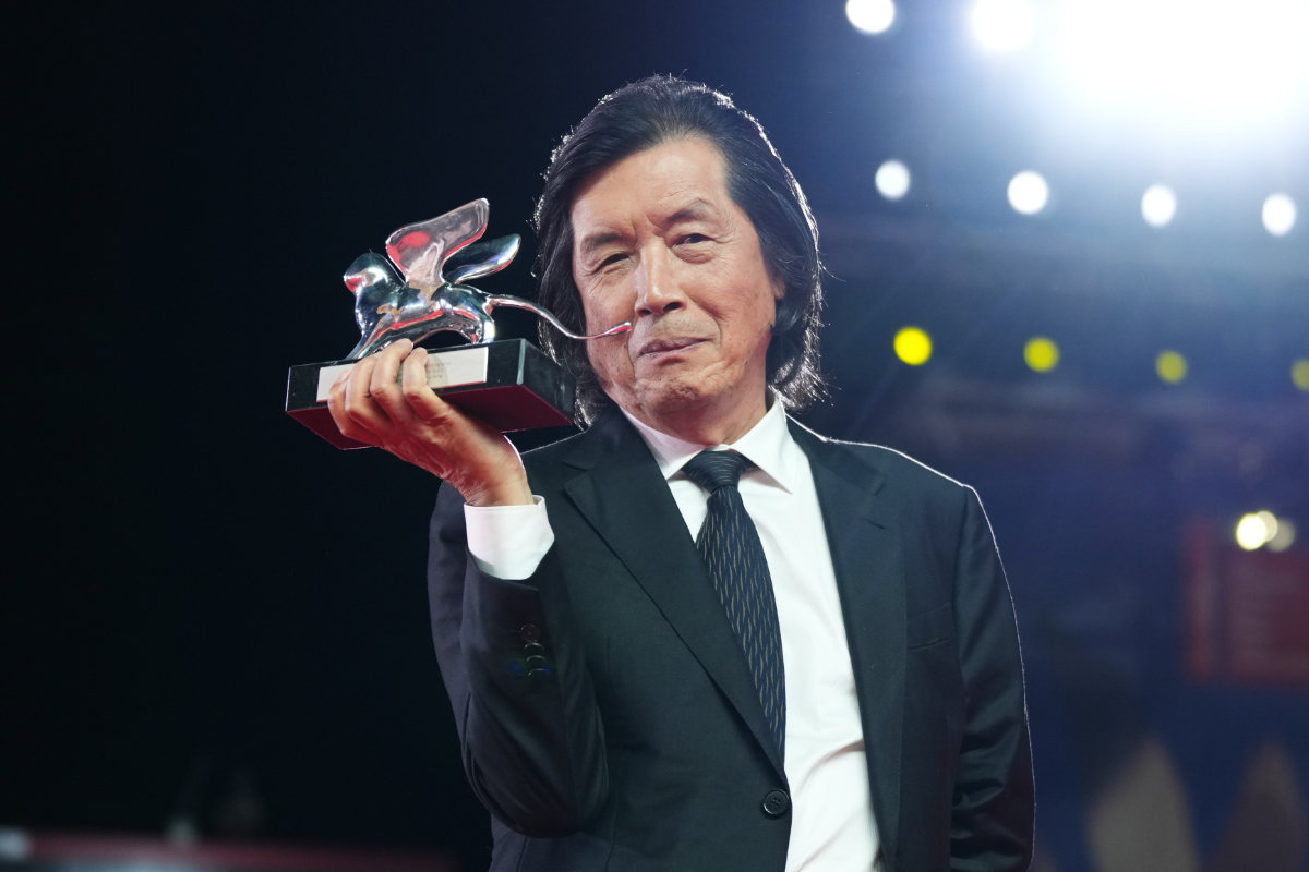 Director Lee Chang-dong, winner of the grand jury prize for the film 'Possible Love', poses for photographers at the awards photo call during the closing ceremony of the 83rd edition of the Venice Film Festival. (Photo by Scott A Garfitt/Invision/AP)