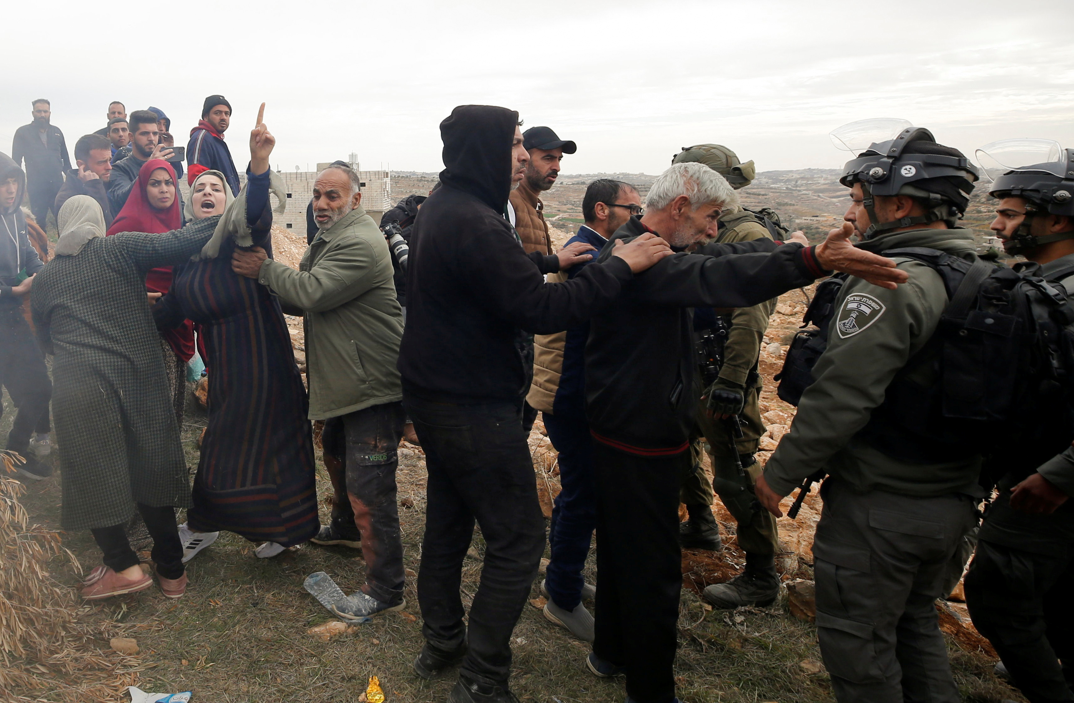 Palestinian protesters confront Israeli security forces during a demonstration in the West Bank, highlighting ongoing tensions in the region.