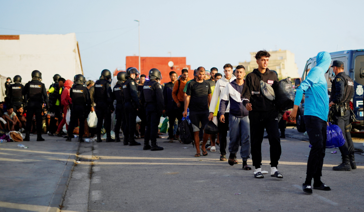 Spain says over 5,300 migrants left Ceuta in month