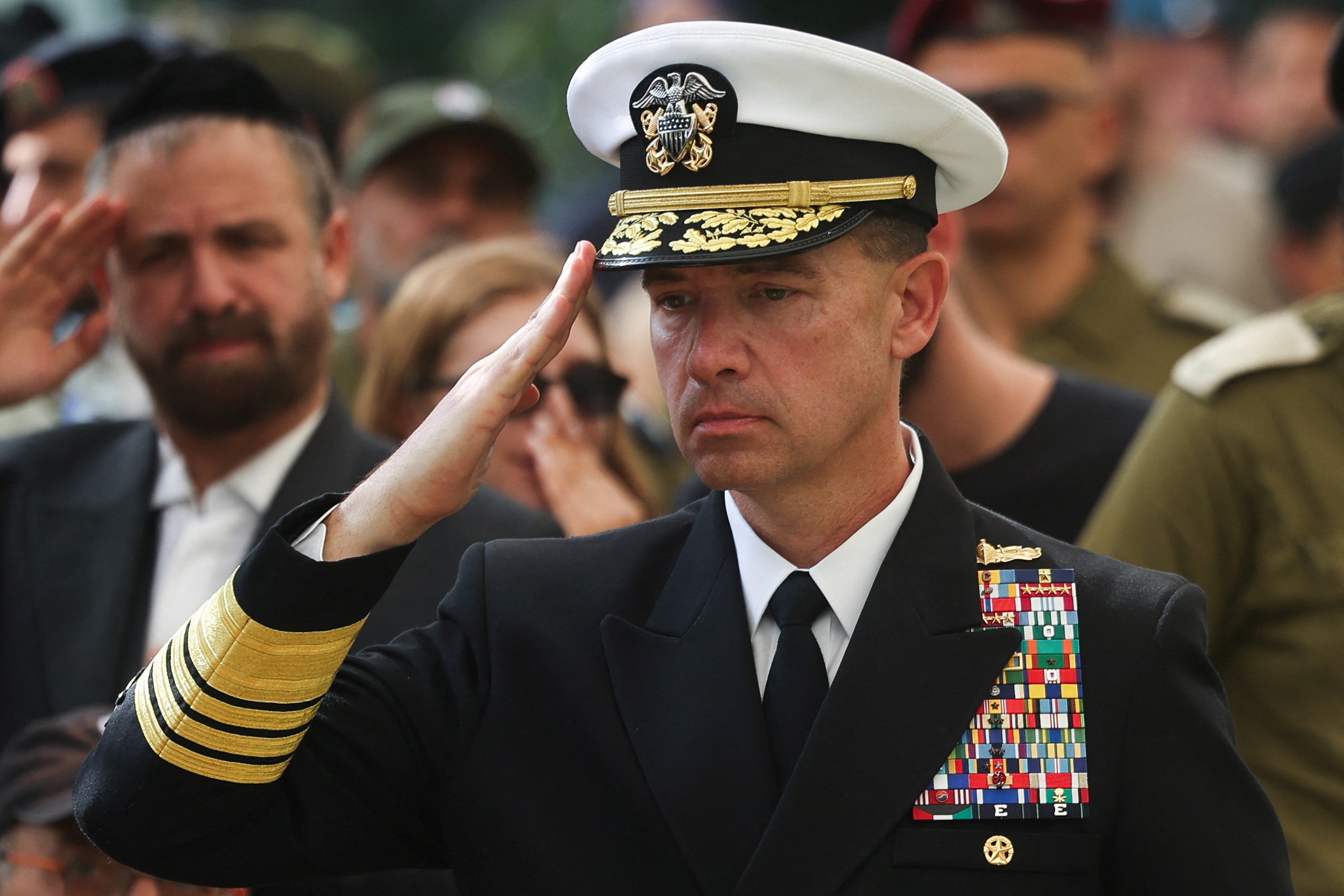 Admiral Brad Cooper, commander of the US Central Command (CENTCOM), salutes during the funeral of American-Israeli hostage Captain Omer Neutra. REUTERS/File