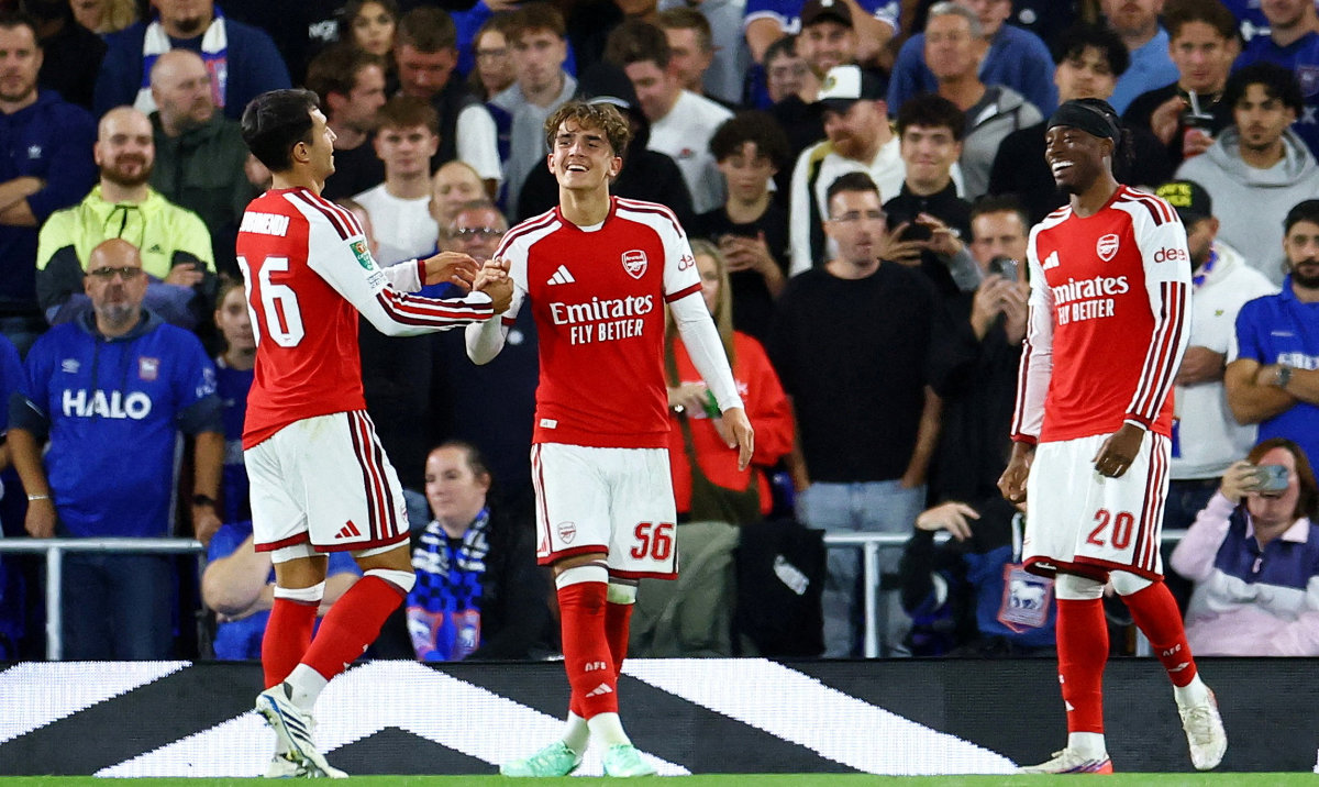 Arsenal's Max Dowman celebrates scoring their third goal with Martin Zubimendi and Noni Madueke. (Reuters)