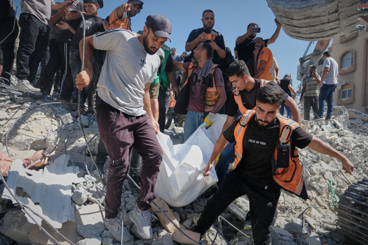 Palestinian civil defense crews carry a body from the rubble of a collapsed building that housed displaced Palestinians and was heavily damaged during the Israel-Hamas war, in Gaza City, Wednesday, Sept. 16, 2026. (AP Photo)