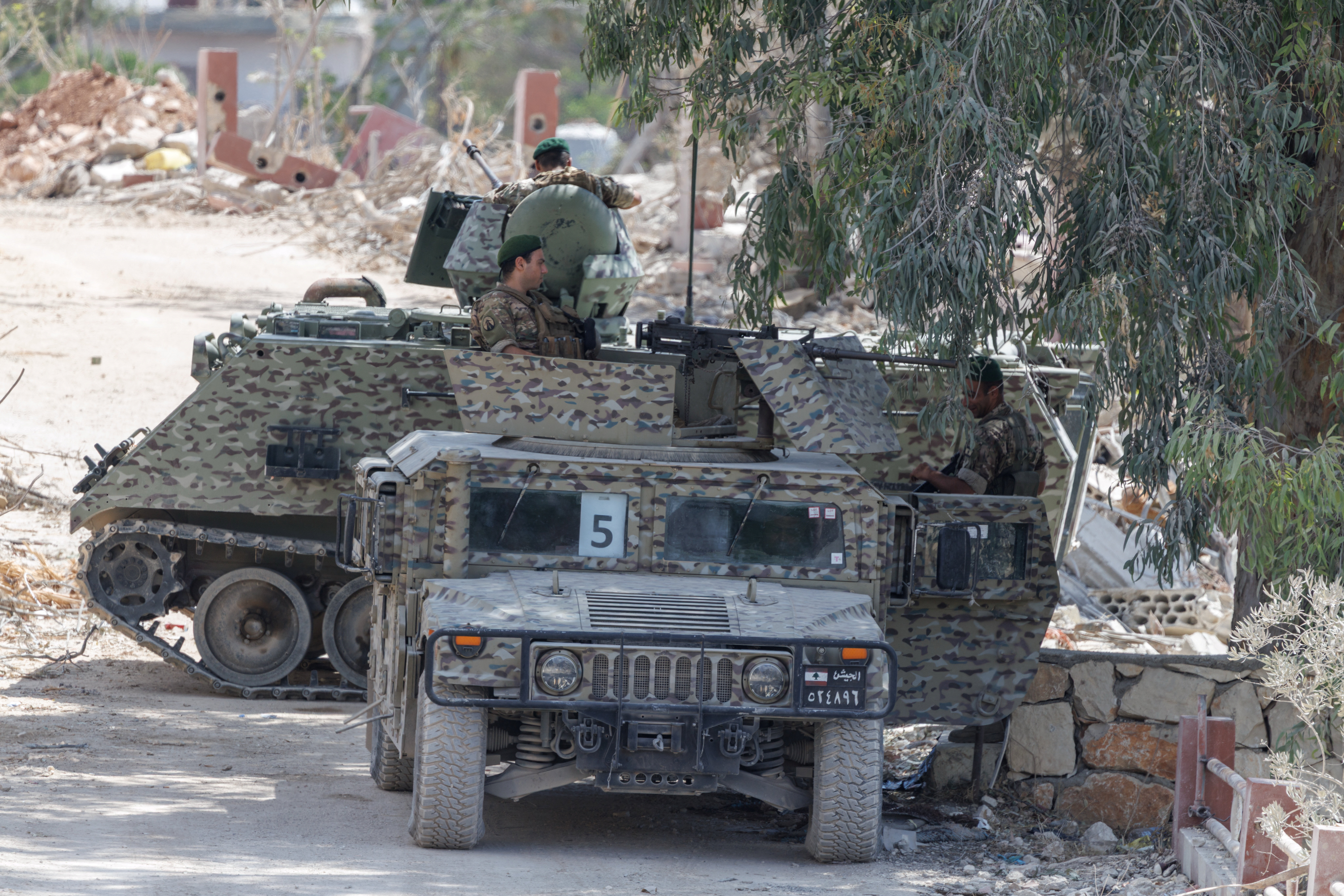 Lebanese army officers hold position in Zawtar al-Gharbiyeh, a village in southern Lebanon, as Lebanese soldiers deploy in one of three so-called pilot zones following the withdrawal of Israeli forces under a U.S.-brokered plan, July 26, 2026. REUTERS/Zohra Bensemra