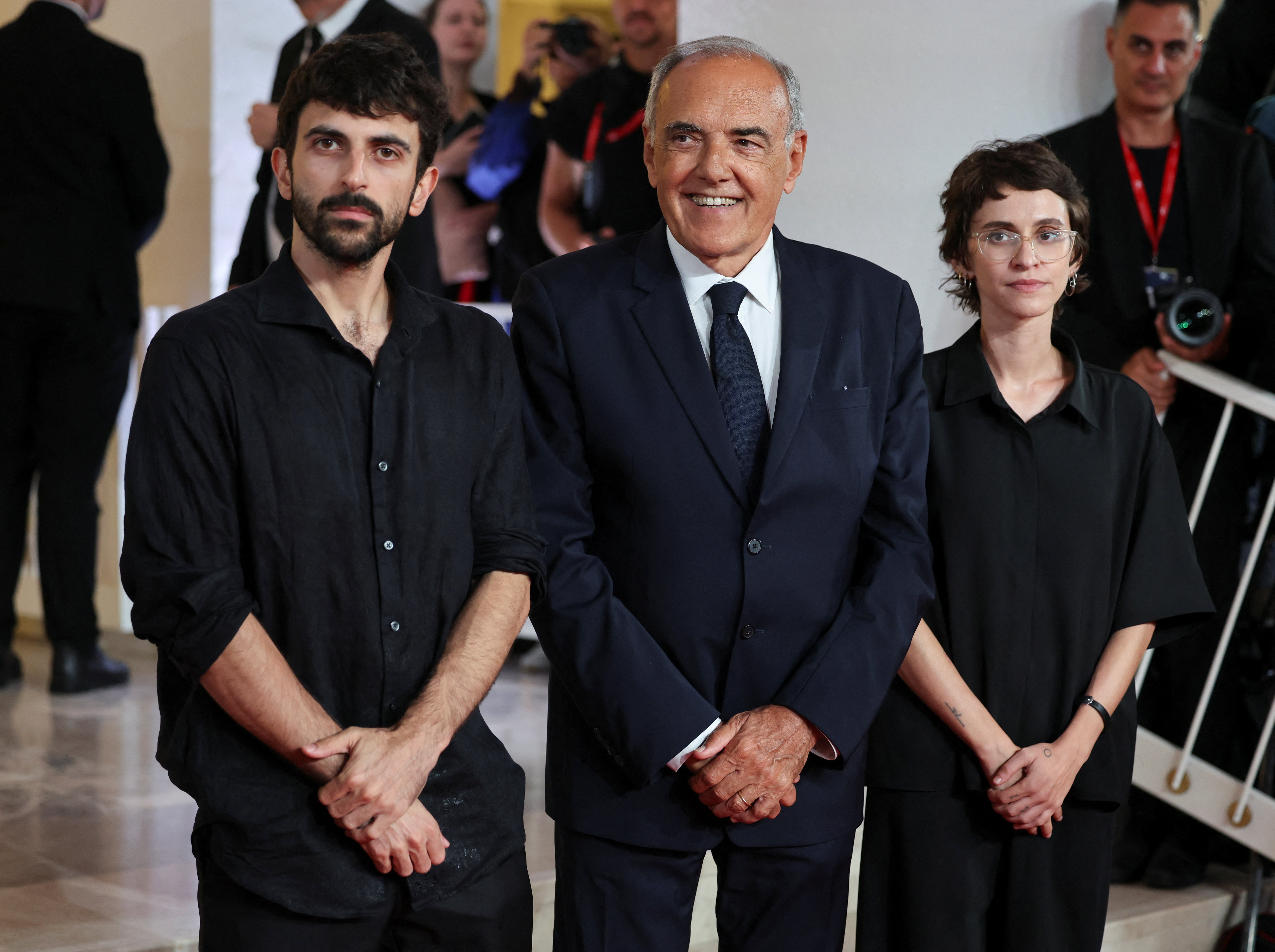 Artistic director of the Venice Film Festival Alberto Barbera and Abraham and Szor at the Venice International Film Festival. (Reuters)