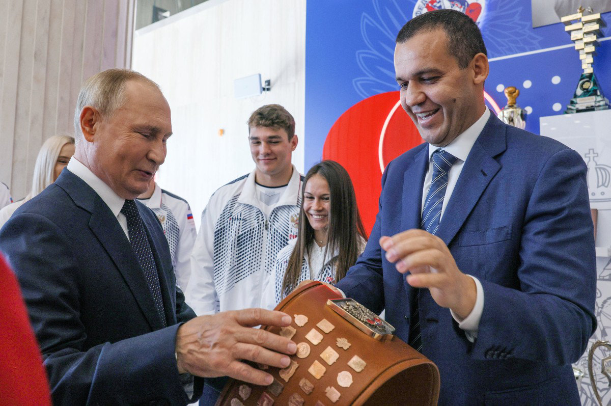 Russia's President Vladimir Putin (L) and International Boxing Association (AIBA) President Umar Kremlev (R) tour the newly opened International Boxing center at the Luzhniki Sports Complex, in Moscow on September 10, 2022. (AFP)