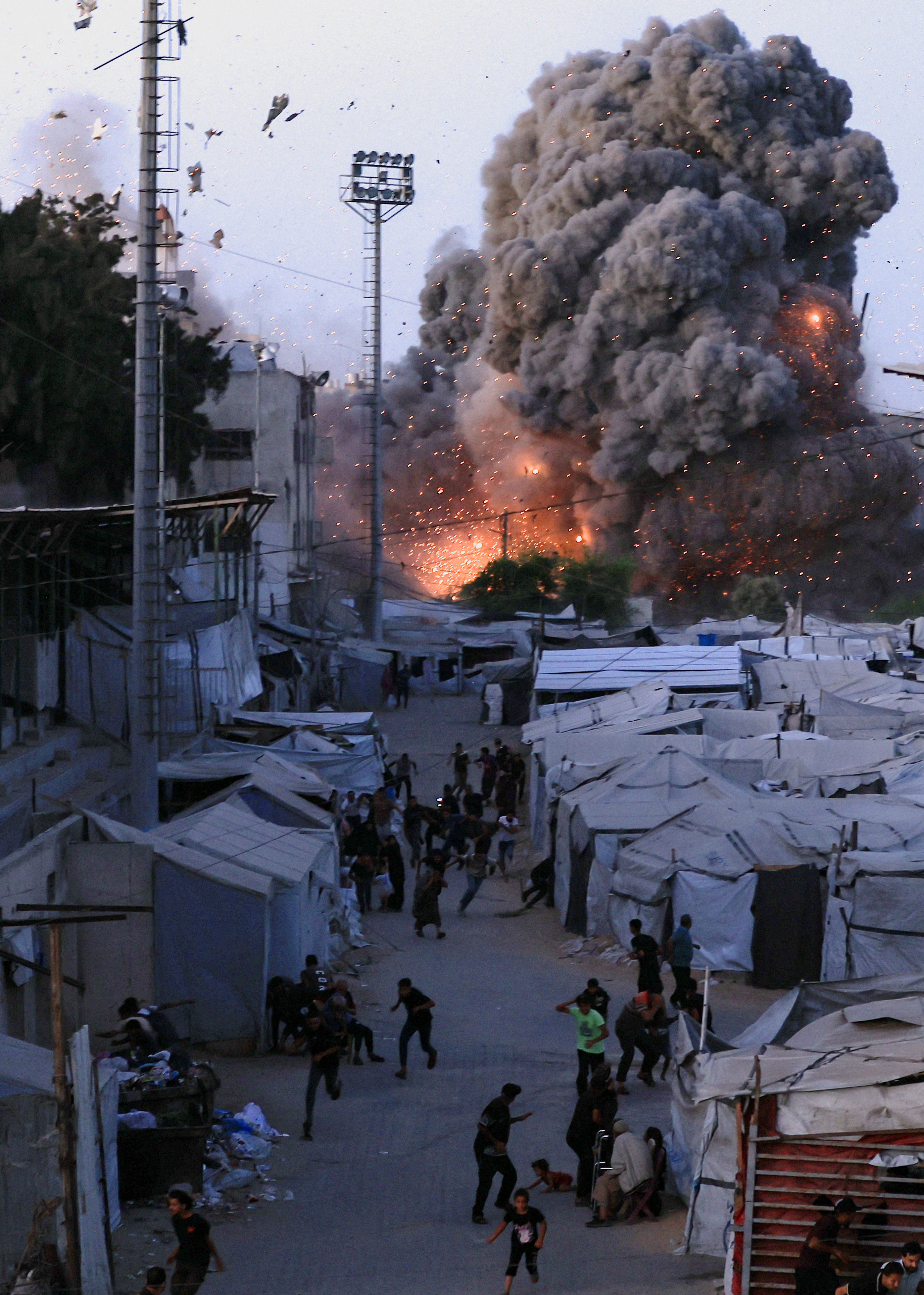 Smoke and flames rise after an Israeli airstrike hit a mosque in Gaza City, July 28, 2026. (Reuters)