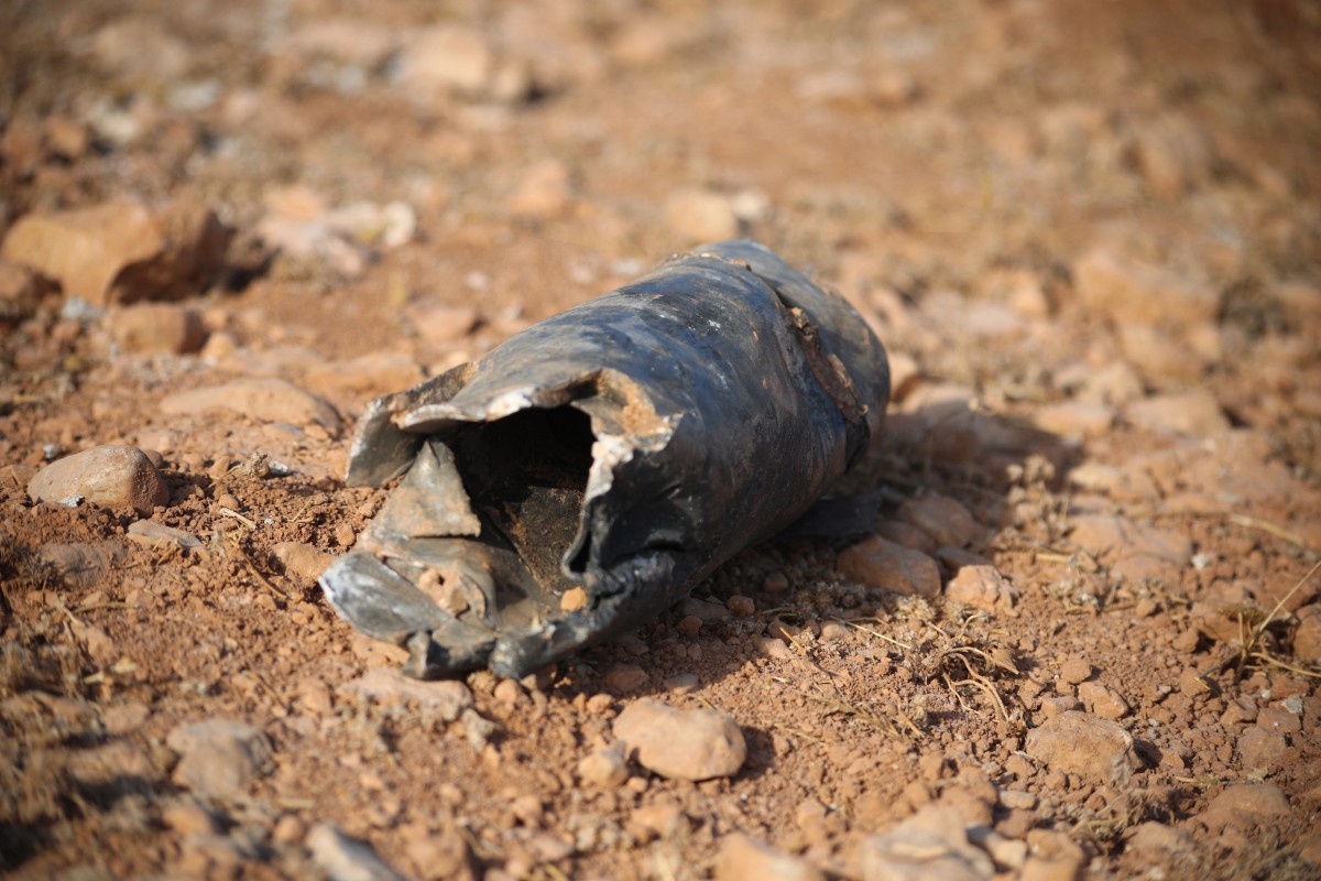 A munition debris lies on the ground following a series of explosions at a Syrian army site in the vicinity of Al-Eis town on September 21, 2026. (AFP)