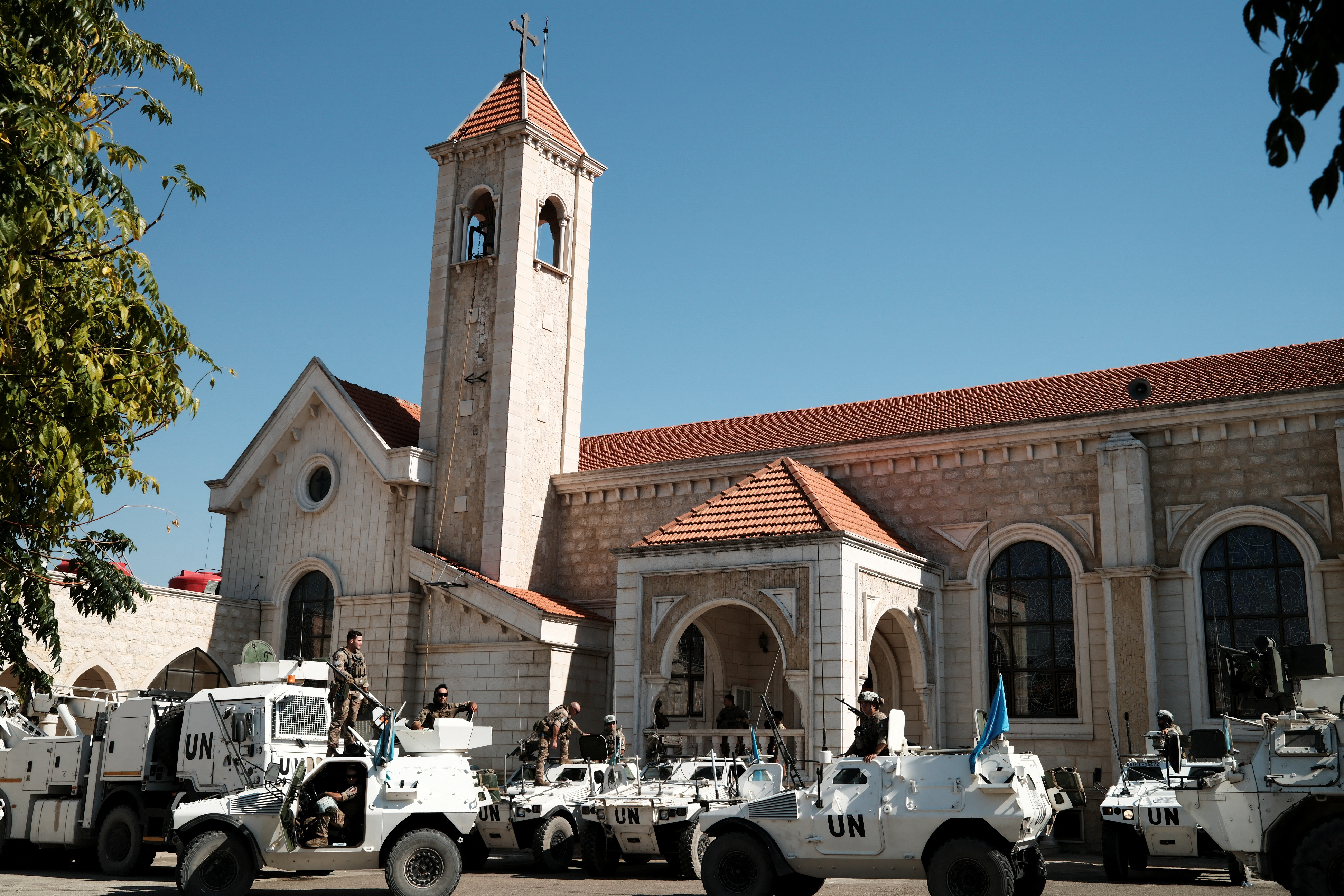 A UNIFIL convoy stands next to a church in Rmeich, near areas occupied by Israeli forces, southern Lebanon, September 12, 2026. REUTERS/File