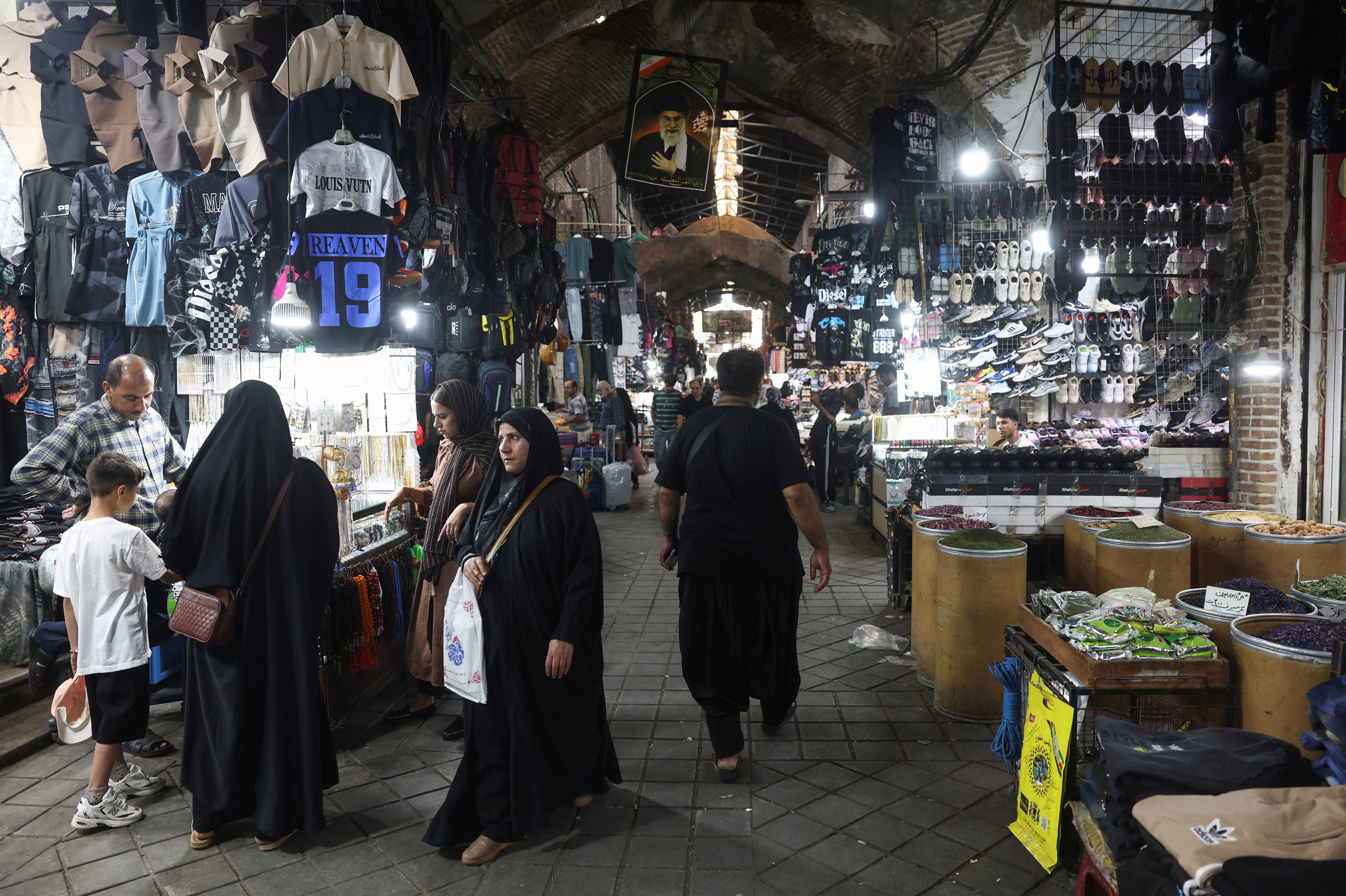 People walk in the Grand Bazaar in Tehran, Iran, August 23, 2026. Reuters file