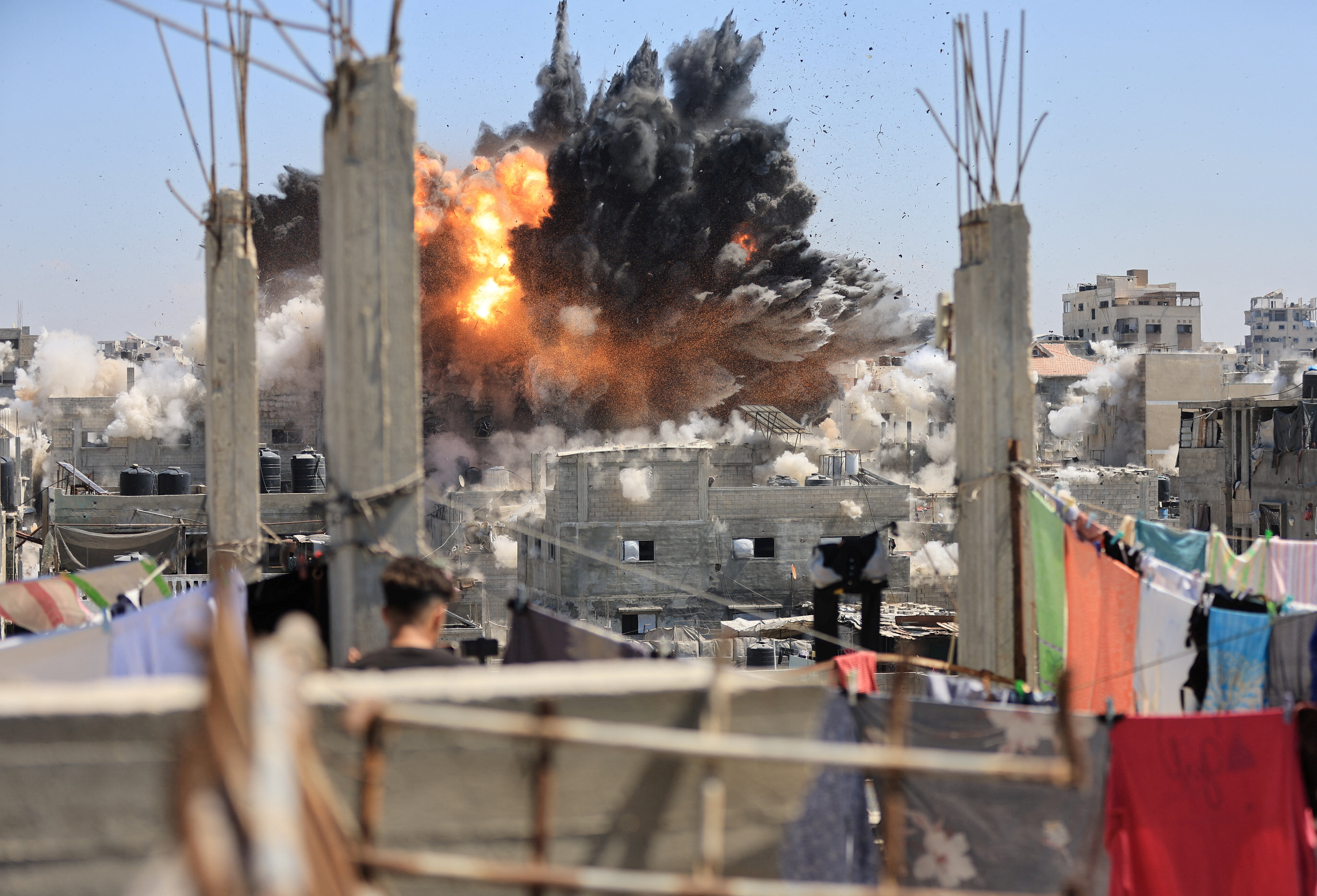 Smoke and flames rise from a house during an Israeli strike in Al-Shati refugee camp in Gaza City. Reuters file