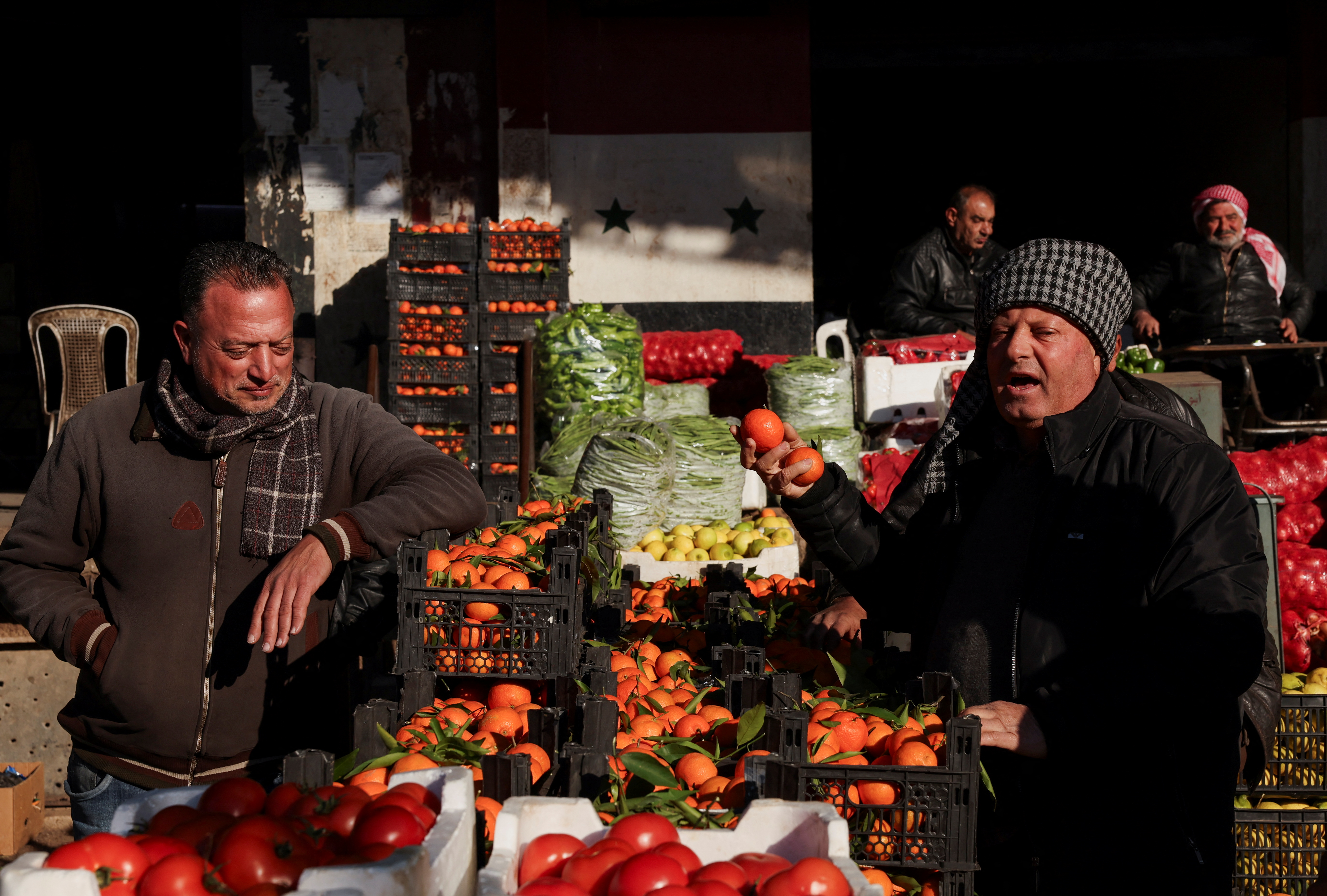 People sell produce at a market, after the ousting of Syria's Bashar al-Assad, in Damascus, Syria, December 16, 2024. (Reuters)