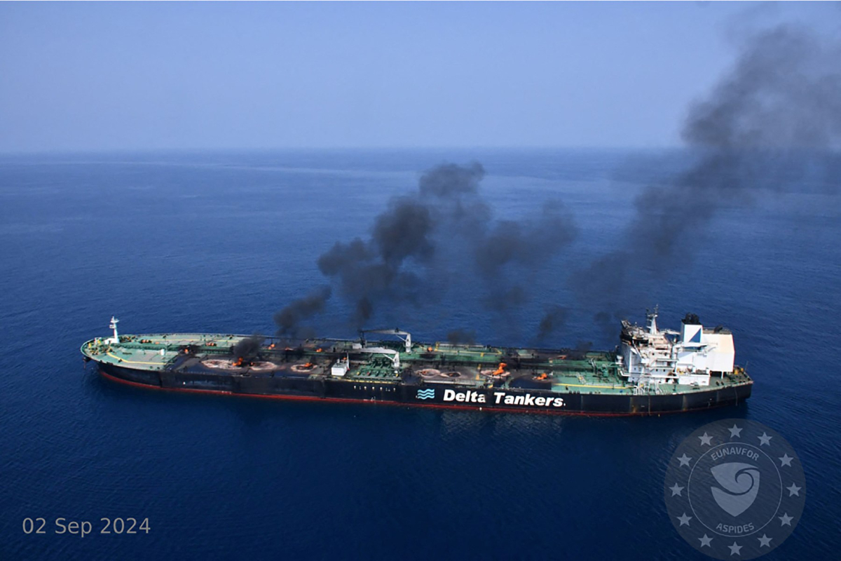 An oil tanker operated by Delta Tankers is engulfed in flames at sea on September 2, 2024, with thick black smoke rising from its deck.