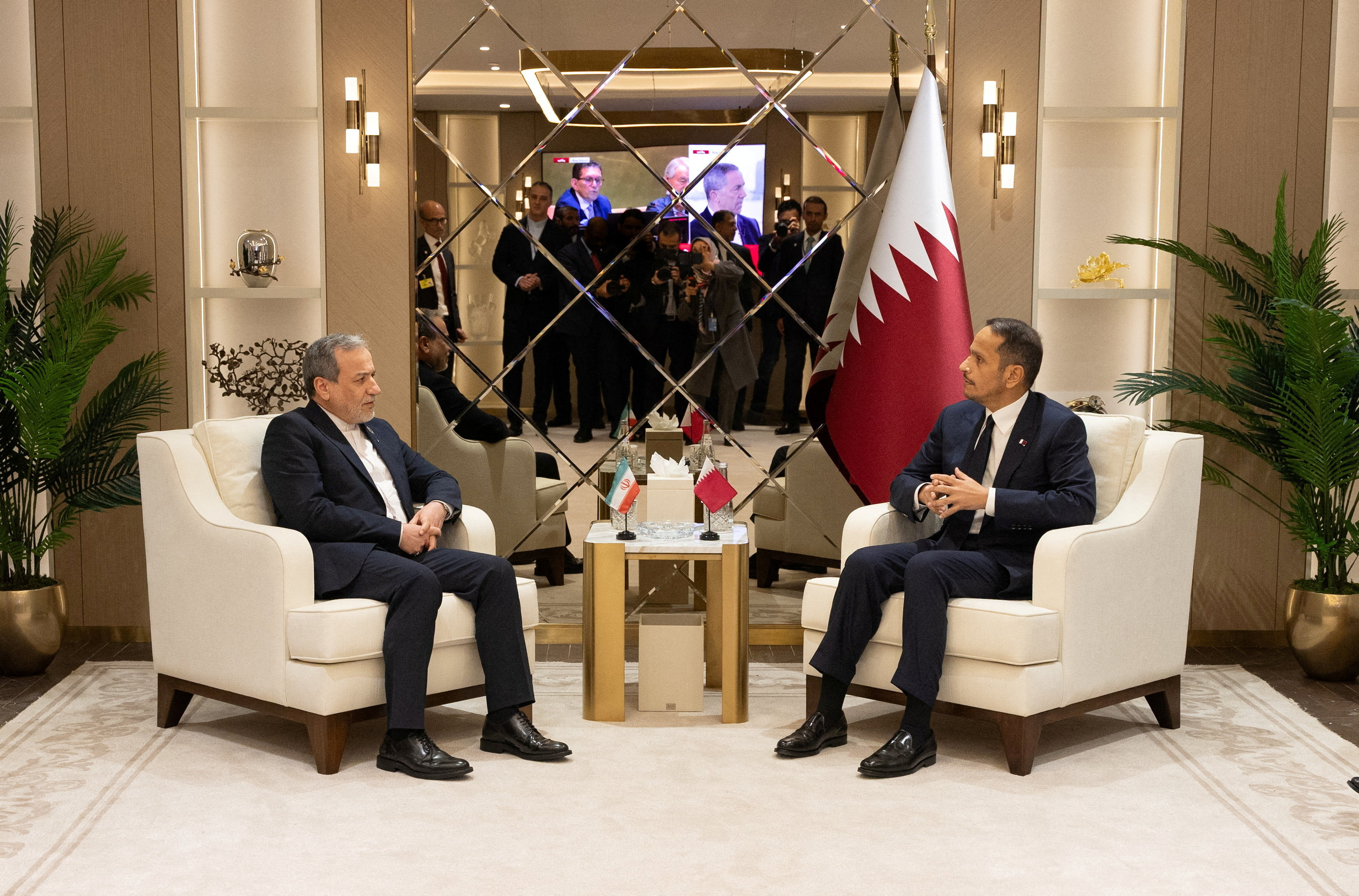 Qatar's PM and Minister of Foreign Affairs Sheikh Mohammed bin Abdulrahman bin Jassim Al-Thani (R) with Iranian FM Abbas Araghchi (L). (Reuters)