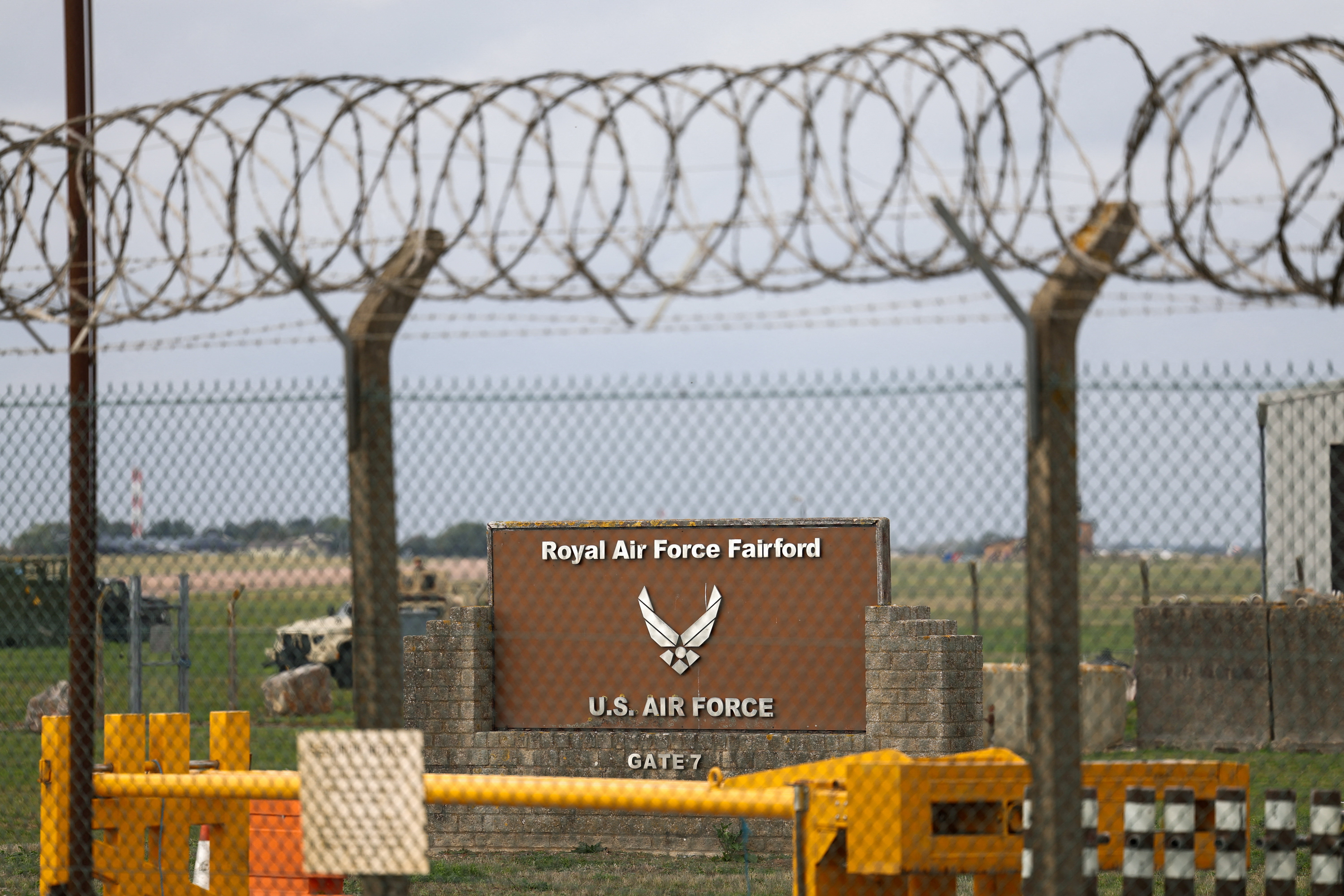 A sign stands behind a fence at the RAF Fairford airbase after police declared a major incident at the base, in Fairford, Gloucestershire, UK. (Reuters file photo)