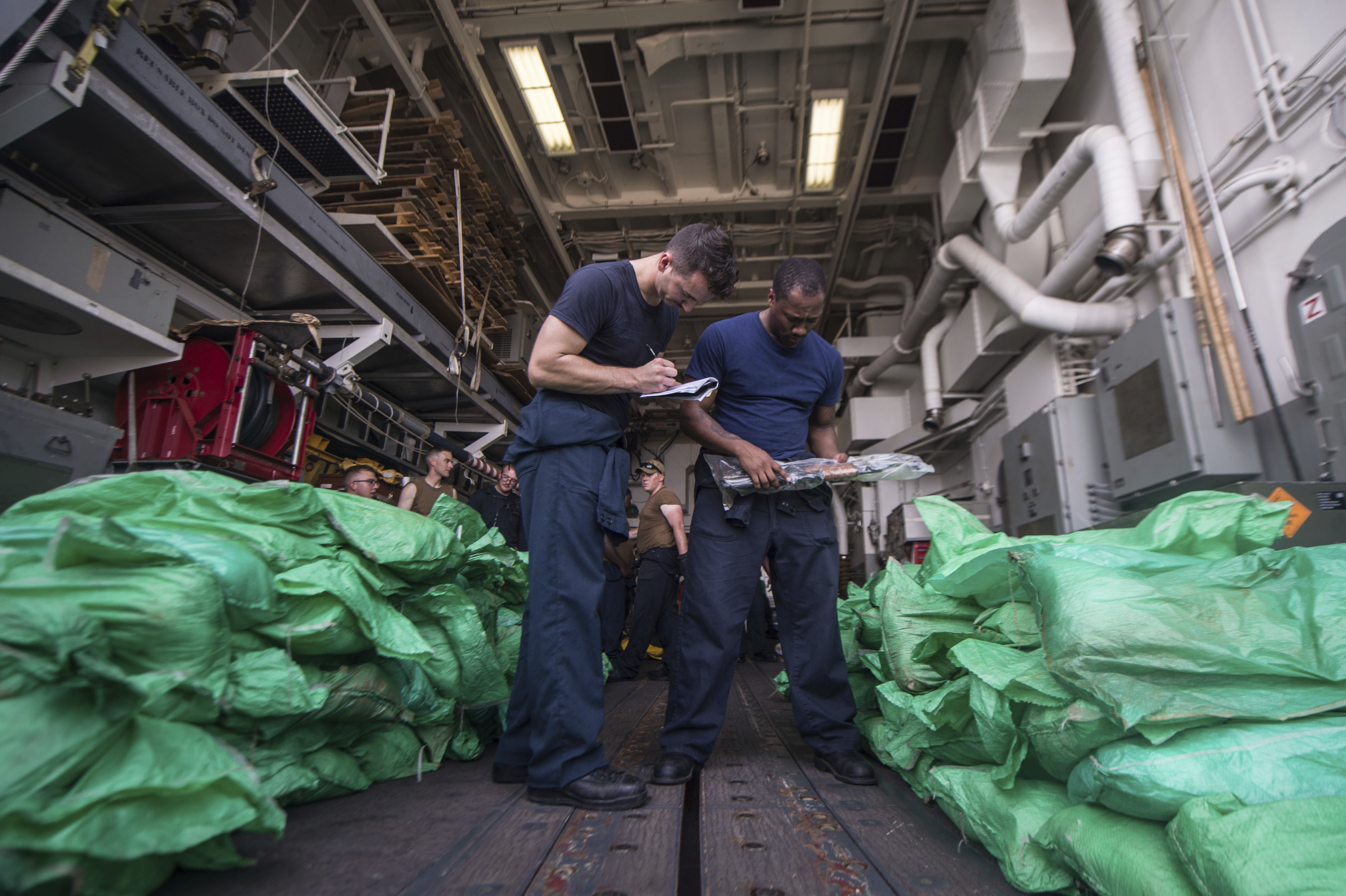 An inventory of a large cache of over 1,000 AK-47 automatic rifles in the hangar bay of the guided-missile destroyer USS Jason Dunham (DDG 109). Garofalo said that “even relatively modest transfers could produce disproportionate effects if they address specific capability gaps.“ (AP file)