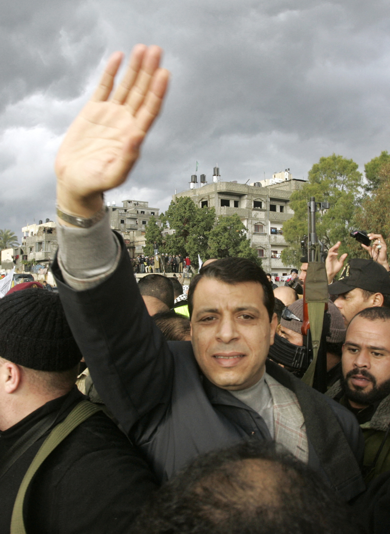 Fatah strongman and lawmaker Mohammed Dahlan waves to his supporters during a Fatah rally in Gaza on January 7, 2007. Certainly, the Hamas-Dahlan alliance will do nothing to dampen Palestinians’ enthusiasm to take part in a national election for the first time in 20 years. (Reuters file)