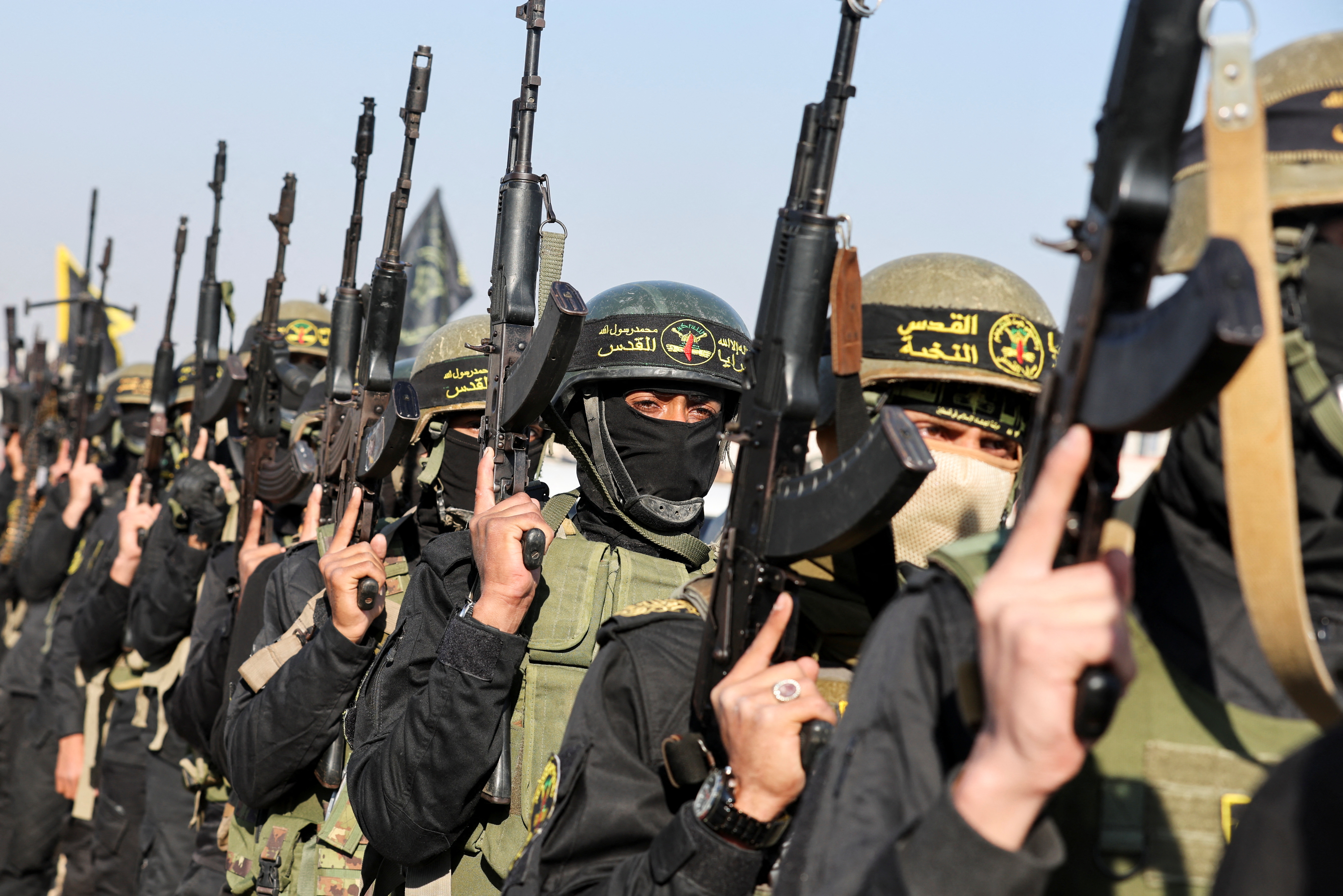 Palestinian Islamic Jihad militants carry rifles as Gaza hostages are handed over to the ICRC. Michale believes that Dahlan, now a UAE adviser, has relayed warnings of the Oct. 7, 2023, attack to Sheikh Mohamed bin Zayed and Benjamin Netanyahu. (Reuters file)