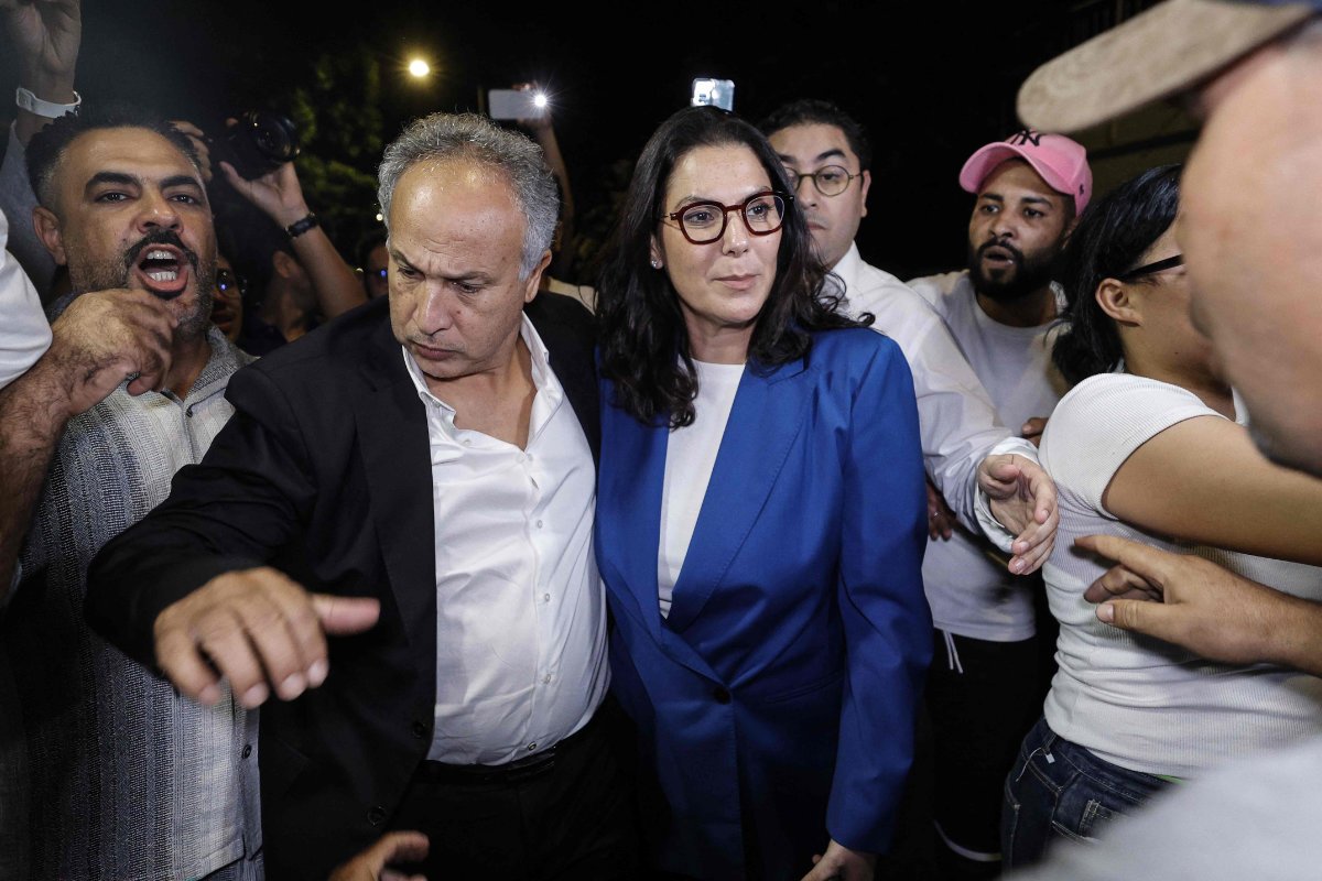 Fatima Ezzahra El Mansouri celebrates with party members after the announcement of the provisional results of the legislative elections in the early hours of September 24, 2026. (AFP)