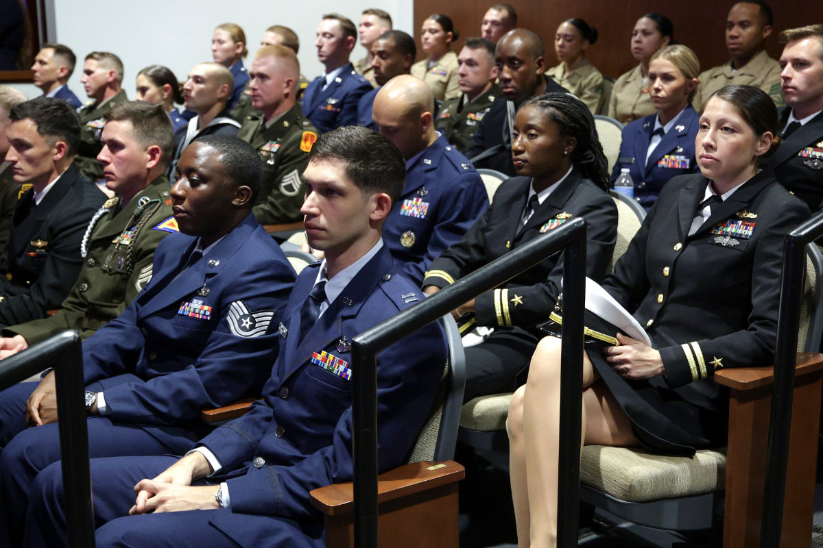 Members of the US military listen as Secretary of Defense Pete Hegseth gives a State of the Force address at Marine Corps Base Quantico on Sept. 30, 2026 in Quantico, Virginia. (Pool Photo via AP)