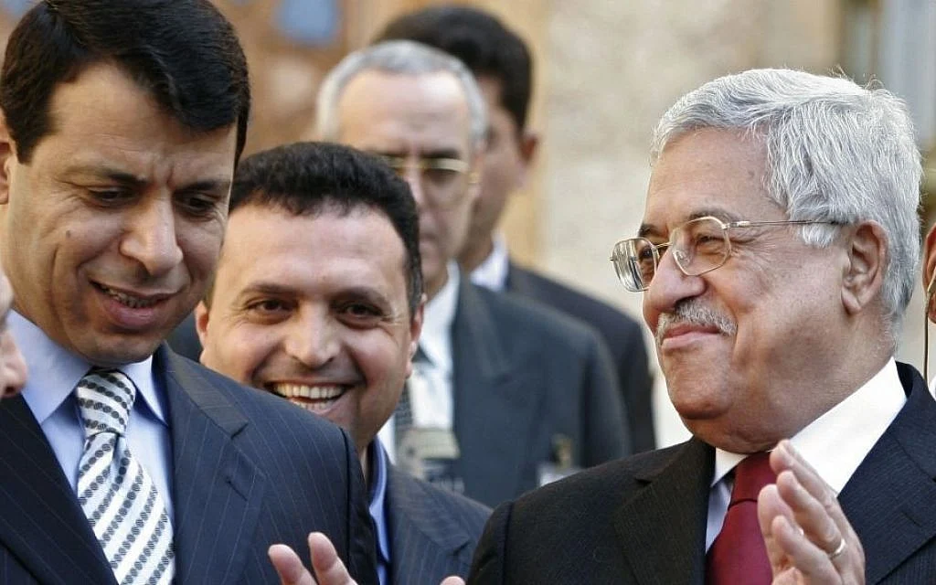 Palestinian Authority President Mahmoud Abbas, right, and Mohammad Dahlan, left, leave a news conference in Egypt, in February 2007. The two feel out in 2011. (AP file)