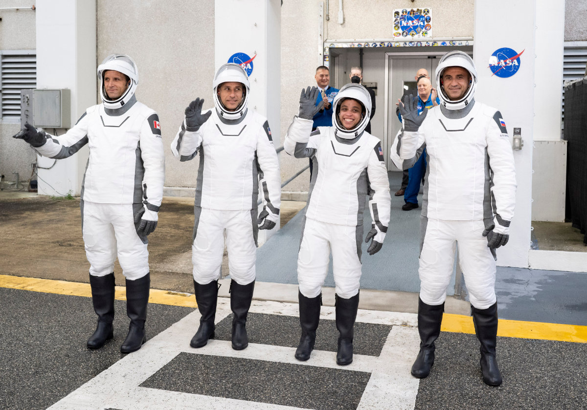 Canadian Space Agency astronaut Joshua Kutryk, left, NASA astronauts Luke Delaney and Jessica Watkins, and Roscosmos cosmonaut Sergey Teteryatnikov, wearing SpaceX spacesuits, prepare to board the SpaceX Dragon spacecraft for the Crew-13 mission launch on Oct. 1, 2026, at NASA's Kennedy Space Center in Florida. (NASA via AP)