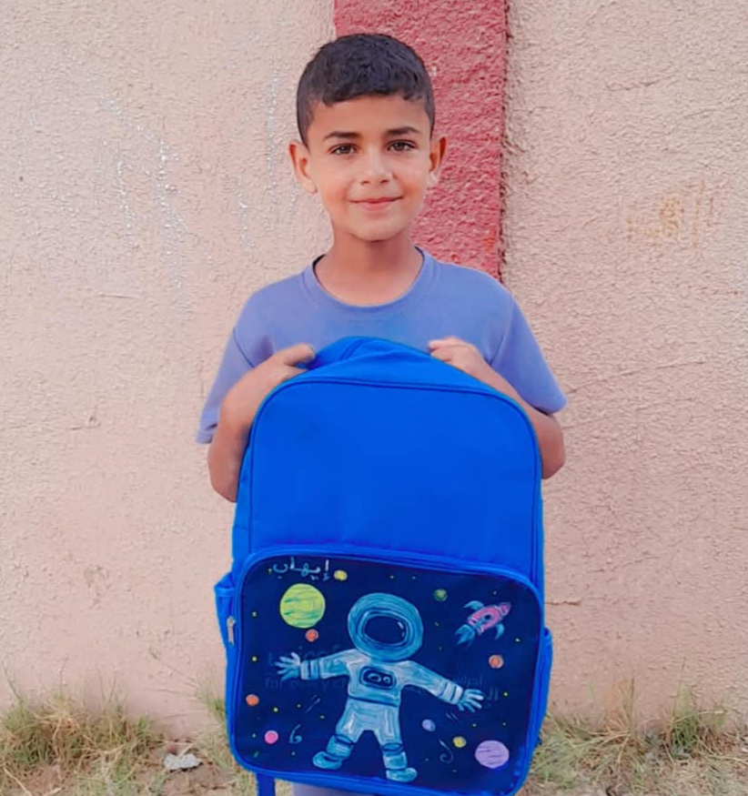 The artist's work gives children a small measure of identity and agency at a time when war and displacement have made personal possessions rare. (Supplied)