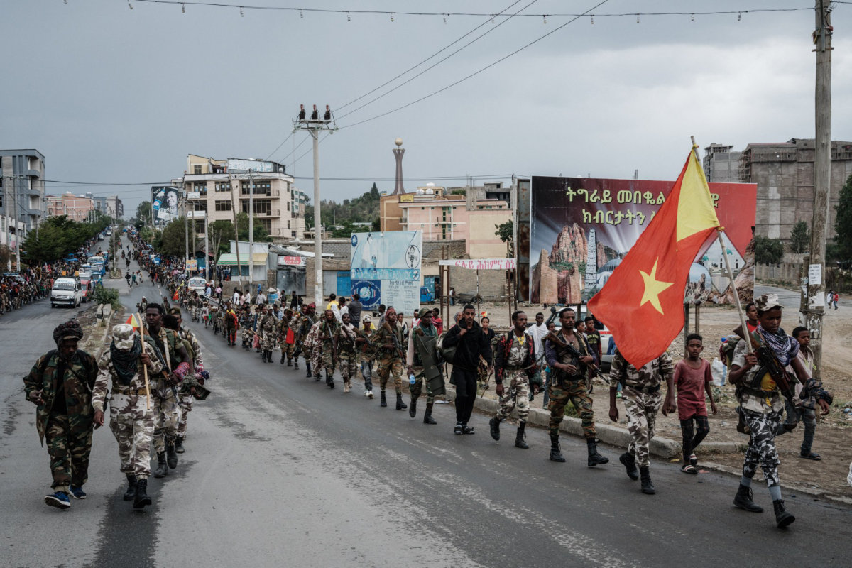 Tigray People's Liberation Front fighters walk in lines towards another field in Mekele, the capital of Tigray region, Ethiopia, on June 30, 2021. (AFP)