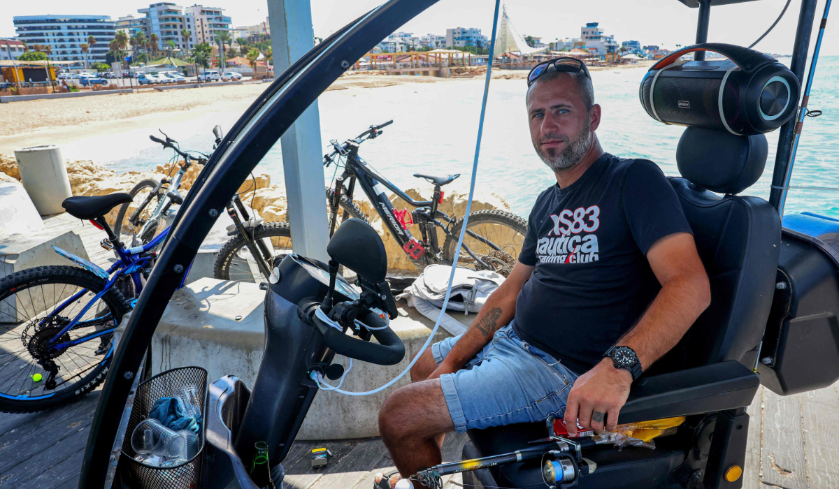 Maxim Zarbaylov, who was born in the former Soviet Union but has long lived in Nahariya, poses for a picture in the northernmost Israeli town on the Mediterranean, on September 24, 2026. (AFP)
