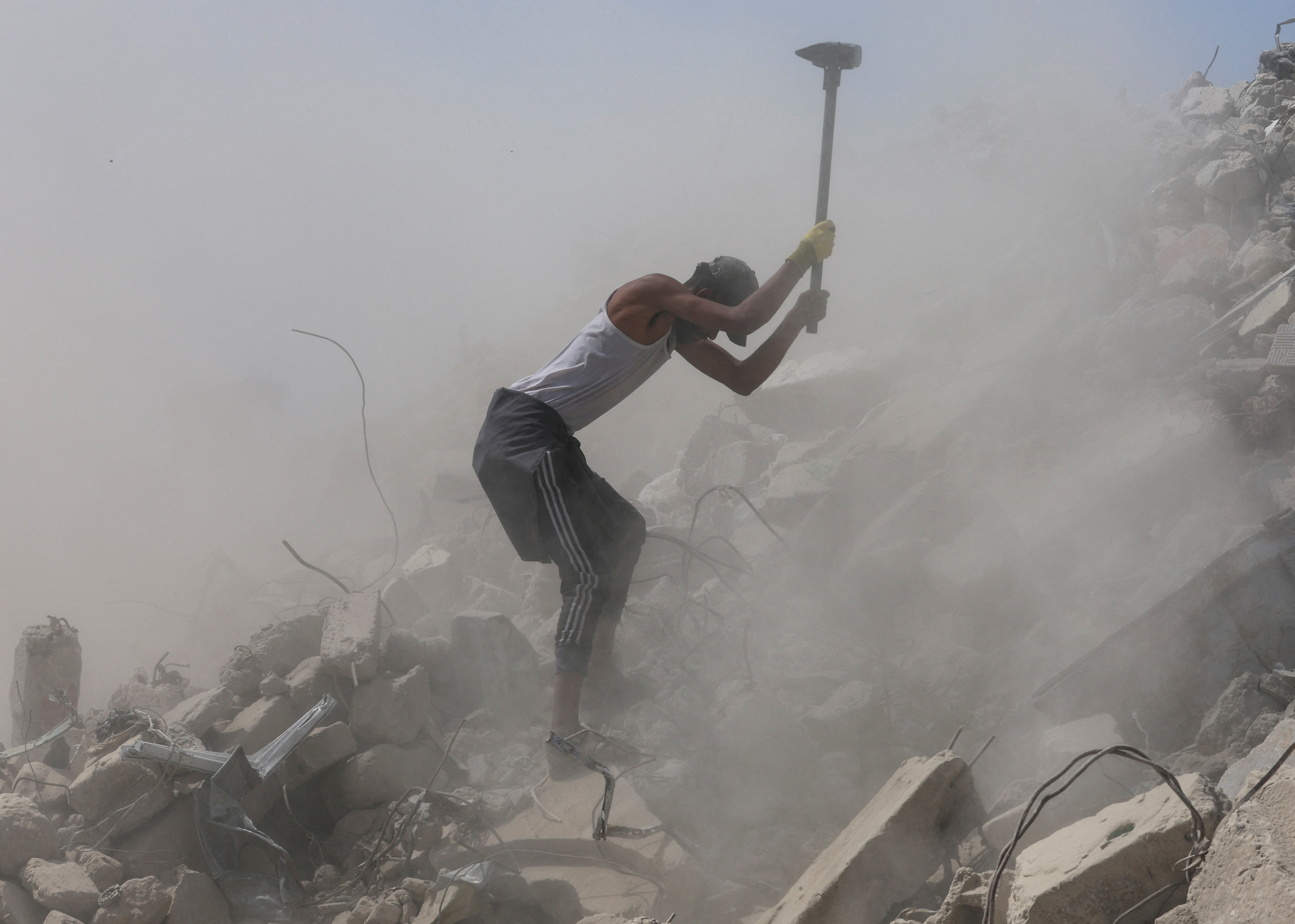 Dust and hazardous materials pose serious health risks, including respiratory illness and potential exposure to asbestos. (Reuters)