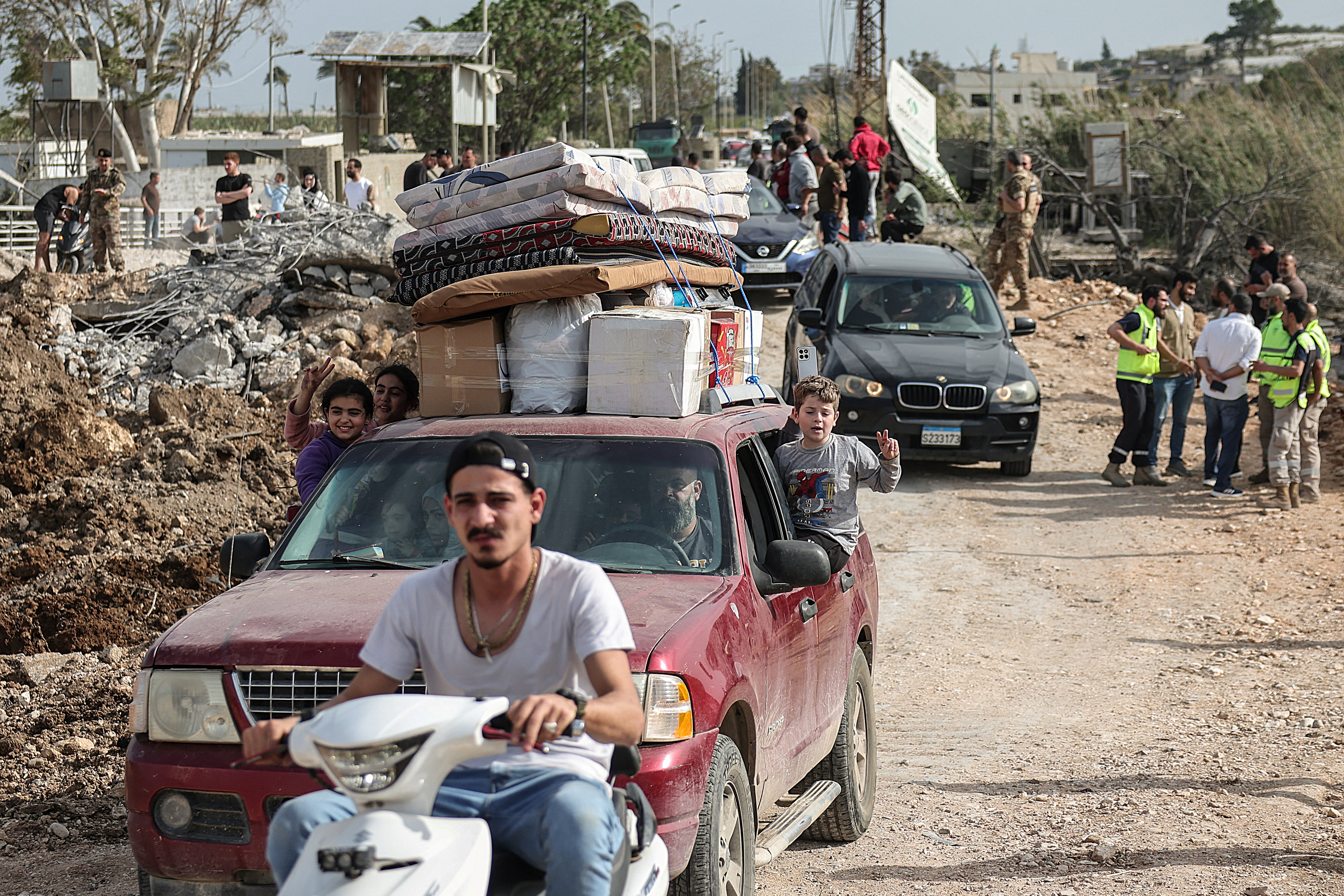 Displaced people return home across a bridge linking southern Lebanon to the rest of the country in Qasmiyeh, Lebanon, on April 17, 2026. Samer said residents covered windows with plastic rather than replace the glass, fearing another war could destroy what remains. (Reuters file)