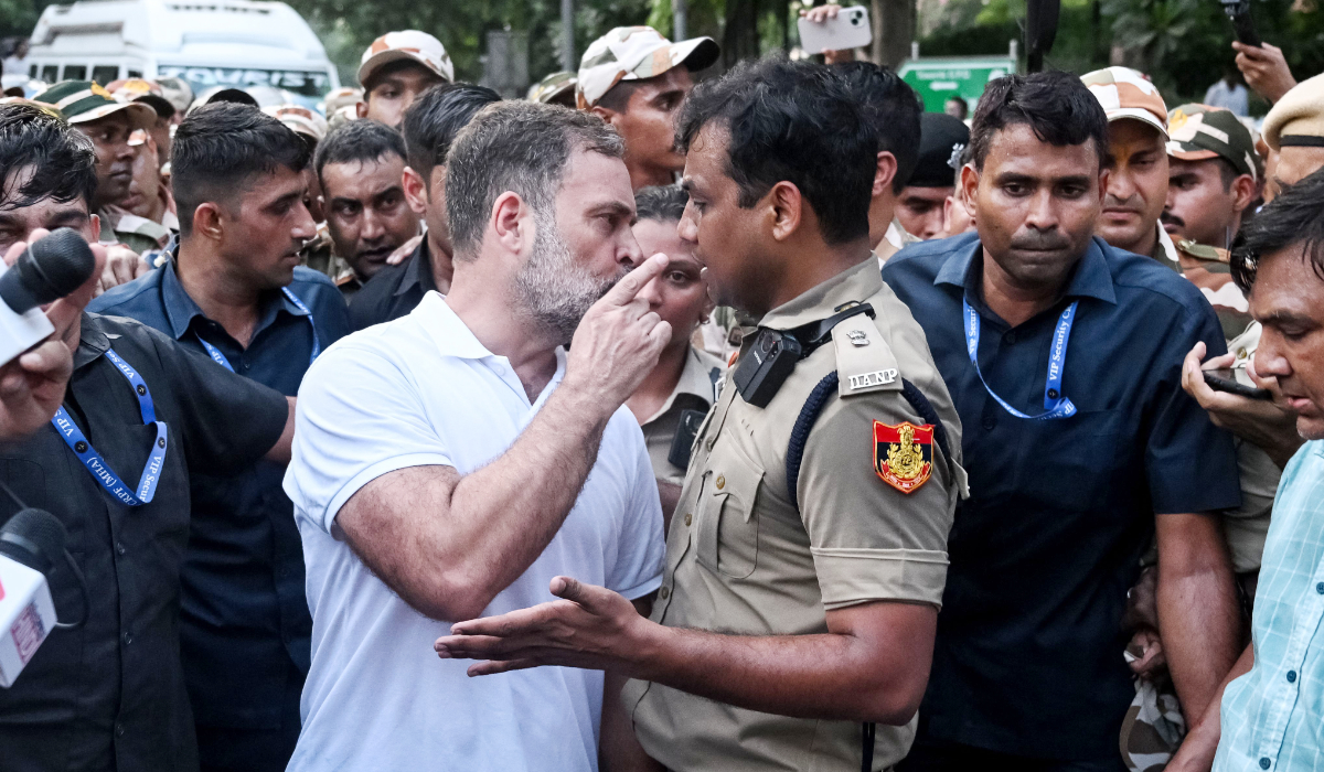 India's Opposition Leader Rahul Gandhi (centre, L) scuffles with a policeman during a protest by the opposition alliance INDIA bloc in New Delhi on October 7, 2026 against the country's Chief Election Commissioner. (AFP)