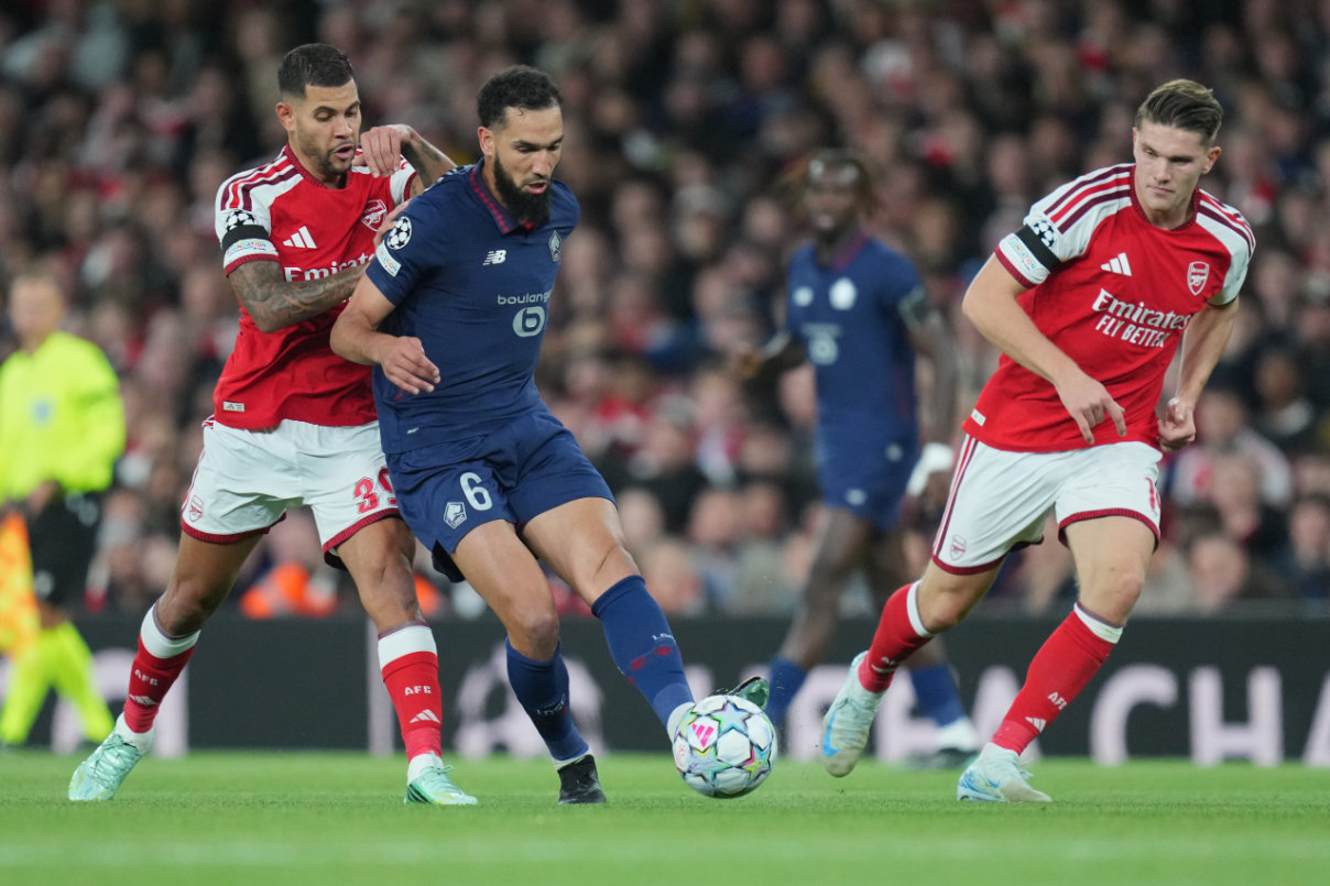 Lille's Nabil Bentaleb passes the ball in front of Arsenal's Bruno Guimaraes during the UEFA Champions League soccer match between Arsenal and Lille in London, Tuesday, Oct. 13, 2026. (AP)