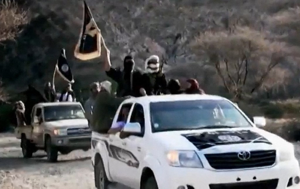 An image grab taken on April 16, 2014 from a video shows AQAP jihadists arriving at a meeting with their chief Nasser al-Wuhayshi at an undisclosed location in Yemen. (AFP File)