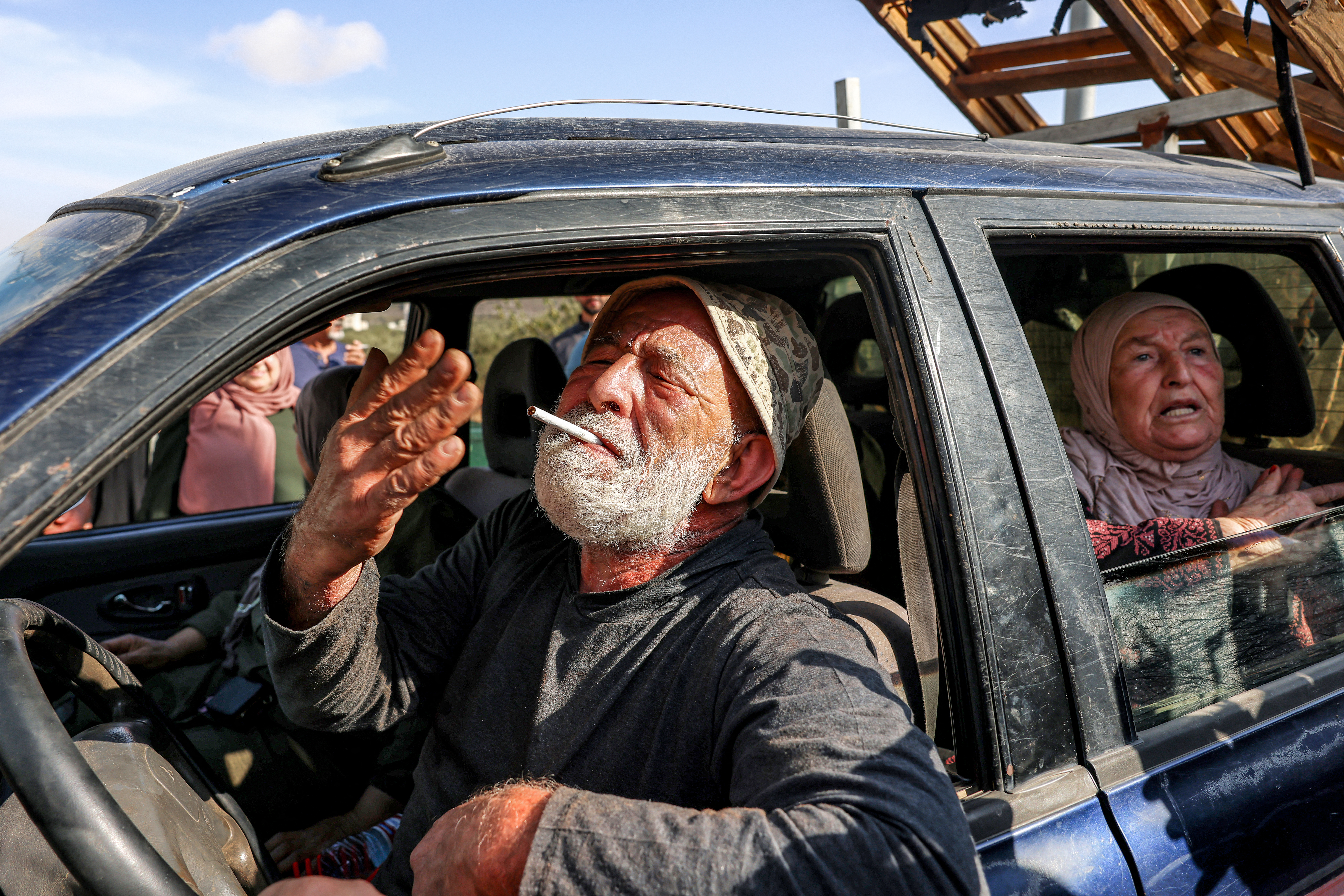 Members of a Palestinian family are forced out of their olive grove by Israeli settlers in Turmus Ayya, northeast of Ramallah. Jaser AbuMousa said the violence intensifies during the harvest because it was ultimately about land. (AFP file)