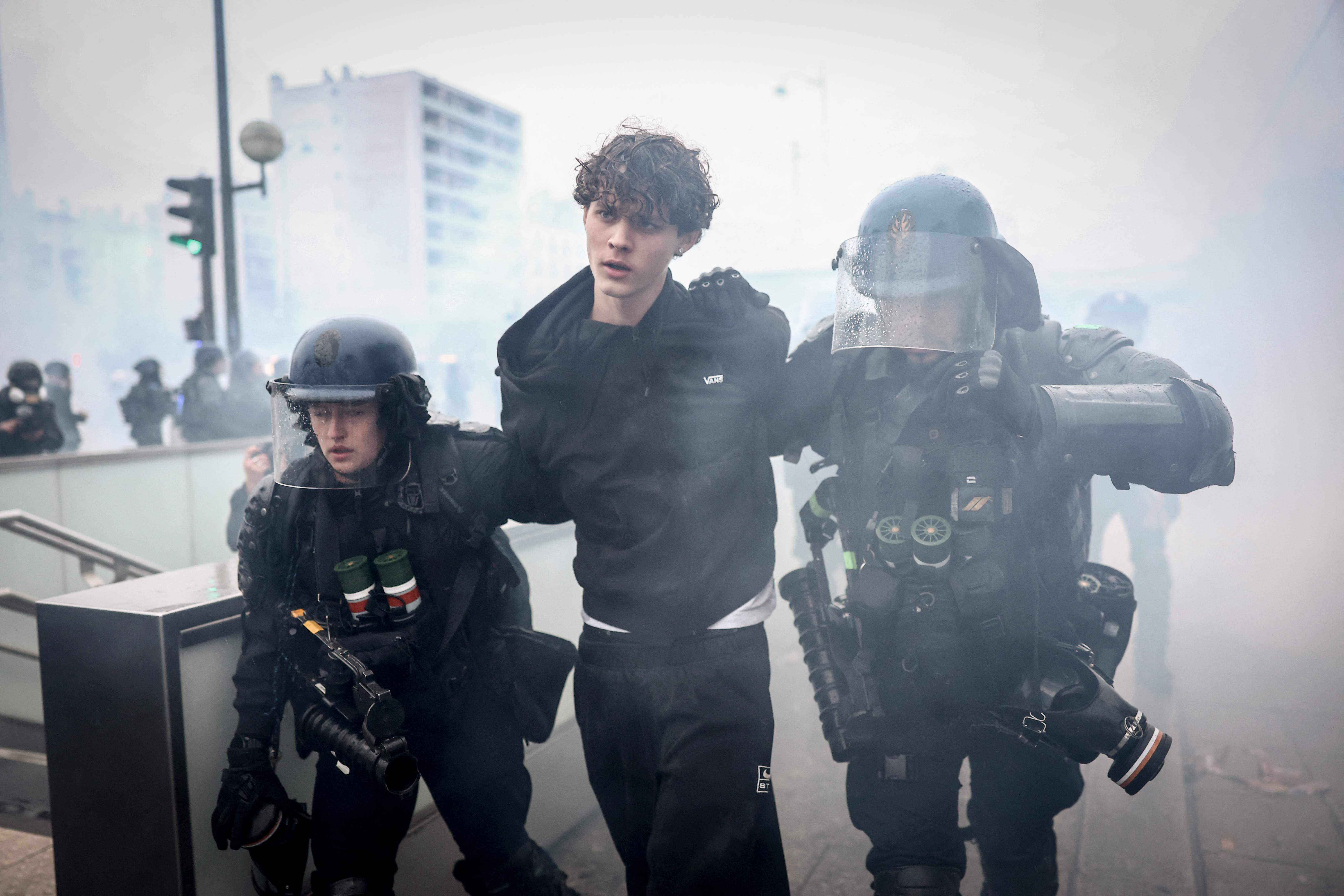 French Gendarmes detain a protester during a demonstration in Paris on Saturday.