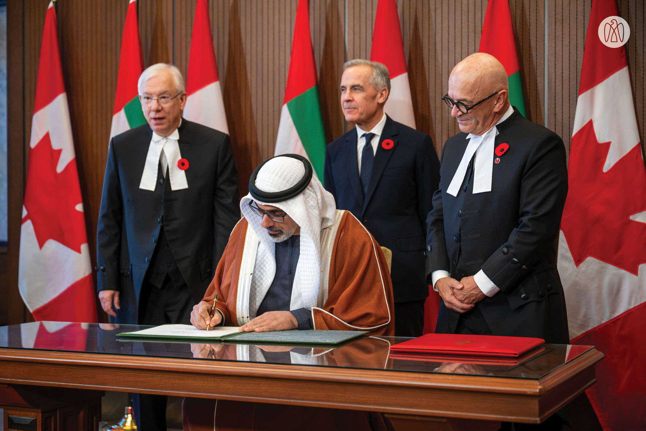 Abu Dhabi’s Crown Prince Sheikh Khaled bin Mohamed bin Zayed Al Nahyan signing the agreement.