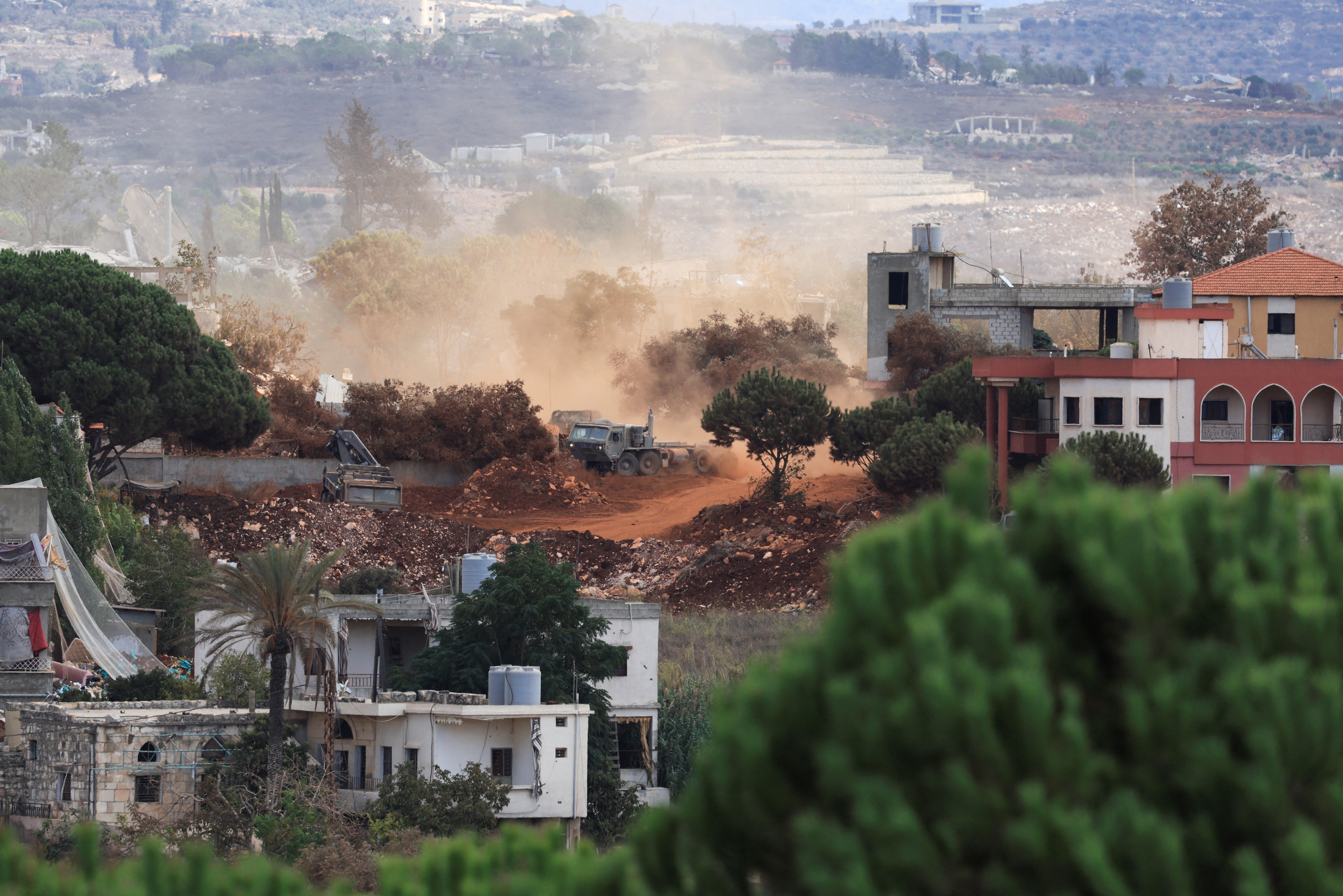An Israeli army vehicle operates in East Zawtar, as seen from West Zawtar, southern&nbsp;Lebanon, October 1, 2026. (Reuters)