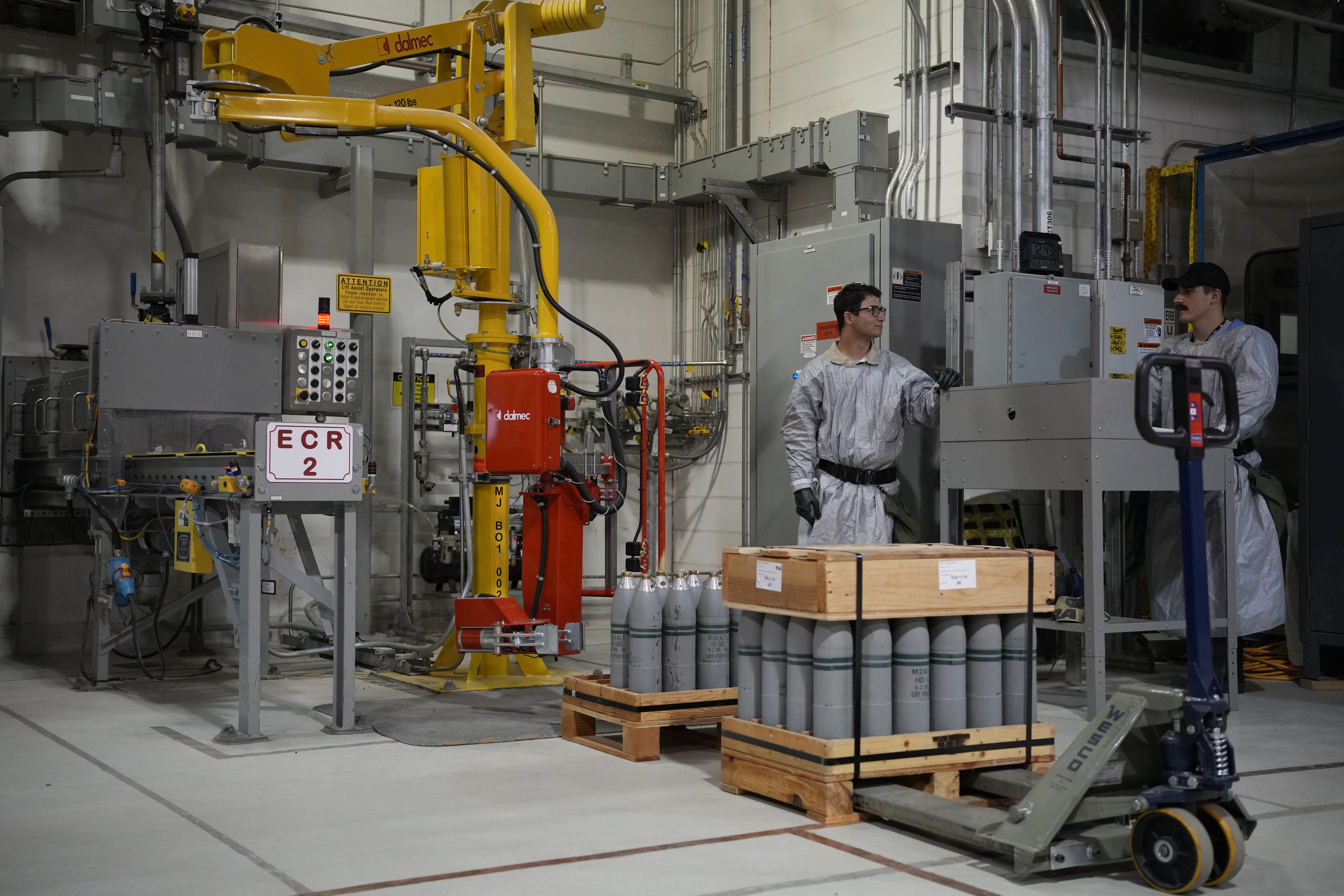 Employees work on destroying the US’s chemical weapons stockpile at the US Army Pueblo Chemical Depot, Colorado. Under the Chemical Weapons Convention, to which Yemen has been a party since 2000, the use of toxic chemicals as weapons is prohibited. (AP/File)
