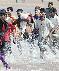 Tidal Waves Kill 12,000 in Asia