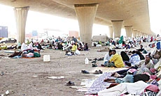 African Pilgrims Abandoned Under Bridge