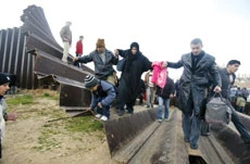 Palestinians Blow Up Wall, Flood Egypt