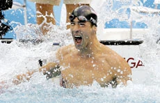 Phelps nails 7th gold by tiniest of margins
