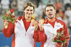 Doubles delight for Federer and partner Wawrinka