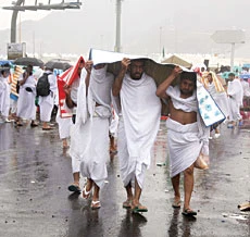 Pilgrims brave downpour