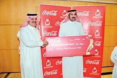 Coca-Cola hands donation to Ensan