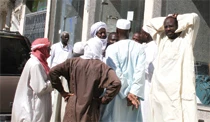 Angry pilgrims block street