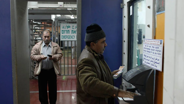 Checkpoint misery accentuates a Mideast divide