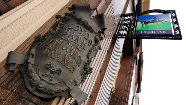 Lloyds shrinks its losses in 2009